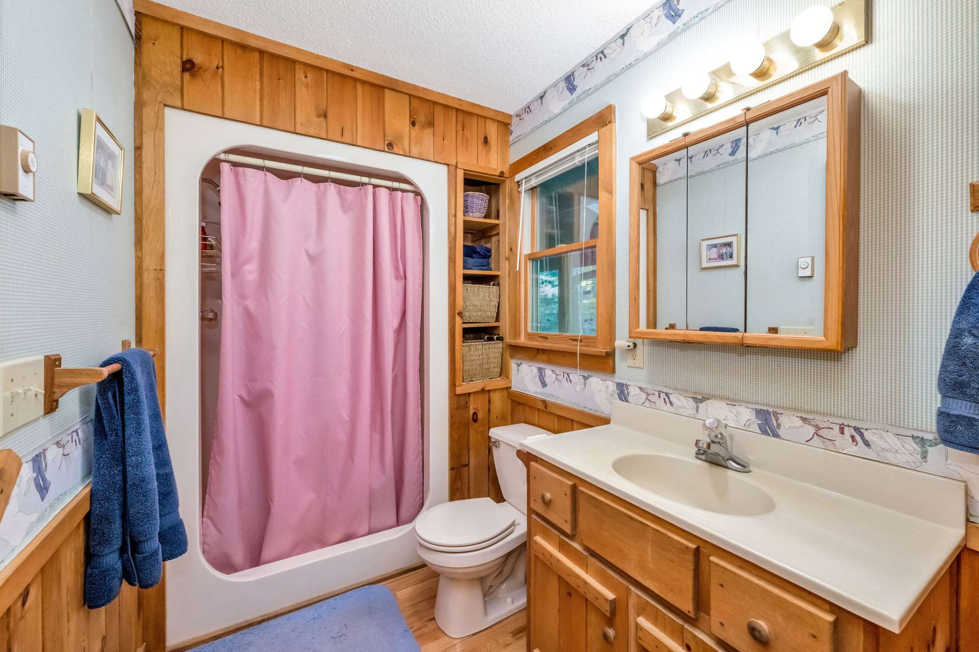 The primary ensuite full bath has an easy step-in shower.