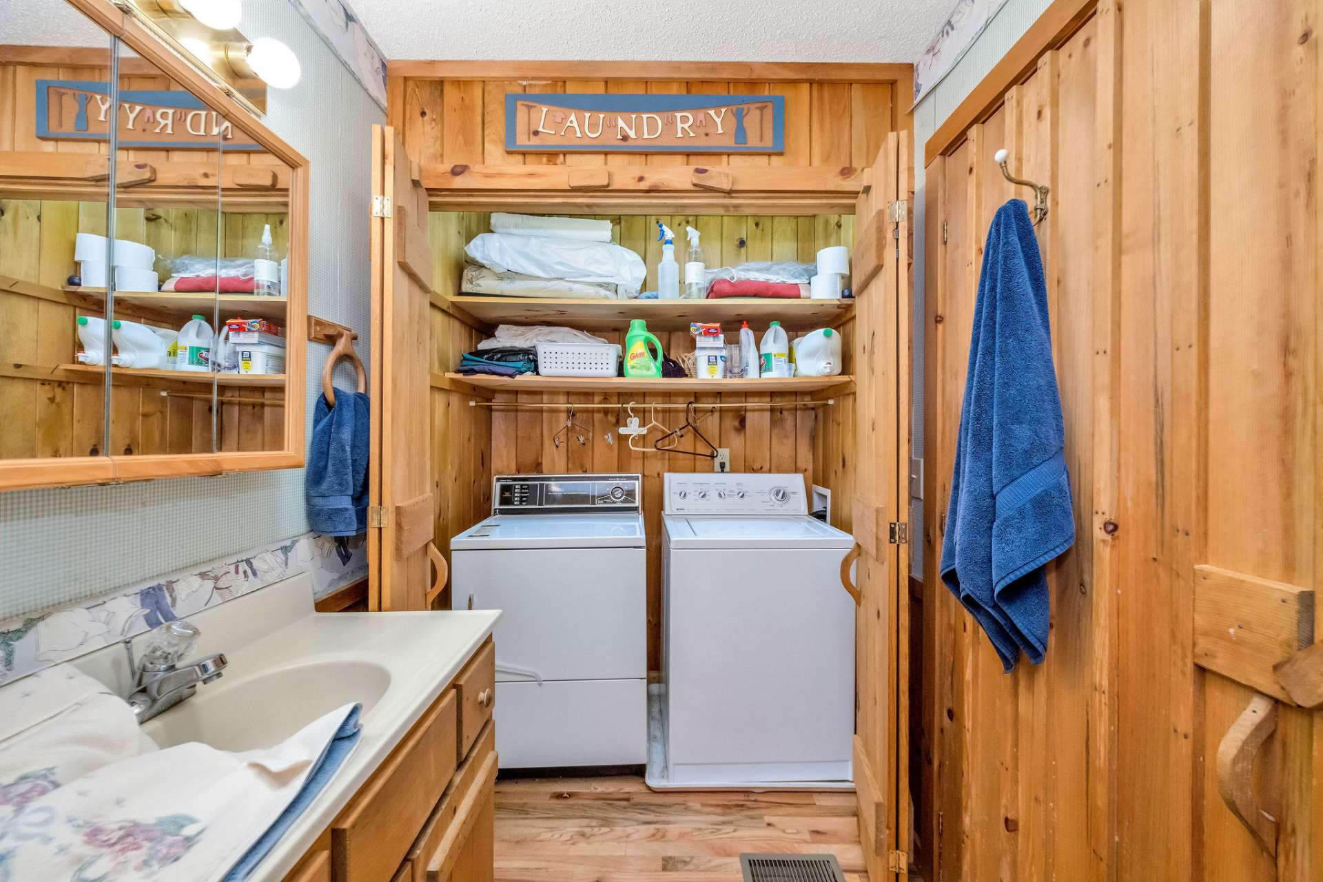 Laundry is discreetly tucked away in the primary bath for convenience.