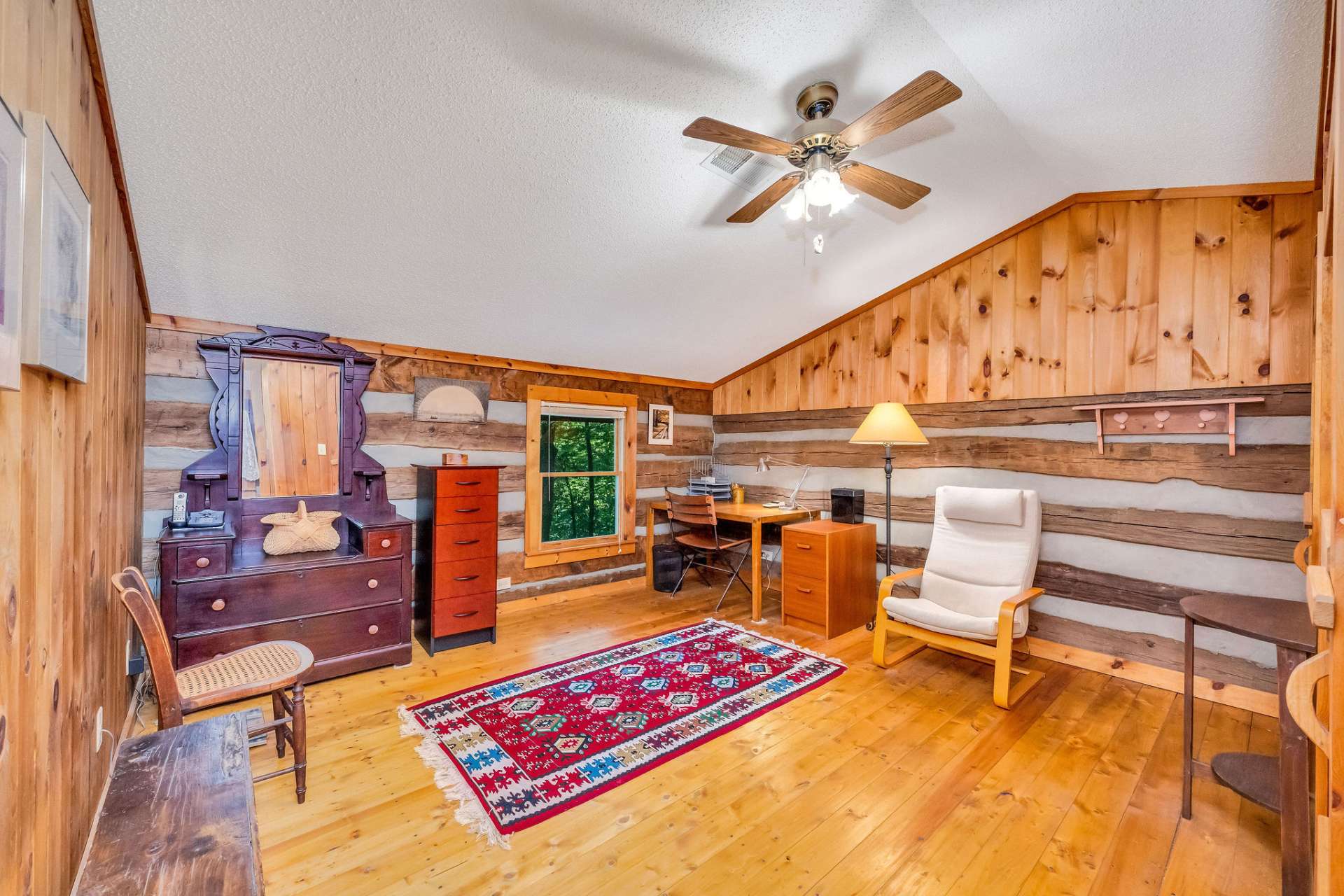 Currently styled as an office, the first bedroom easily converts into a spacious guest haven.