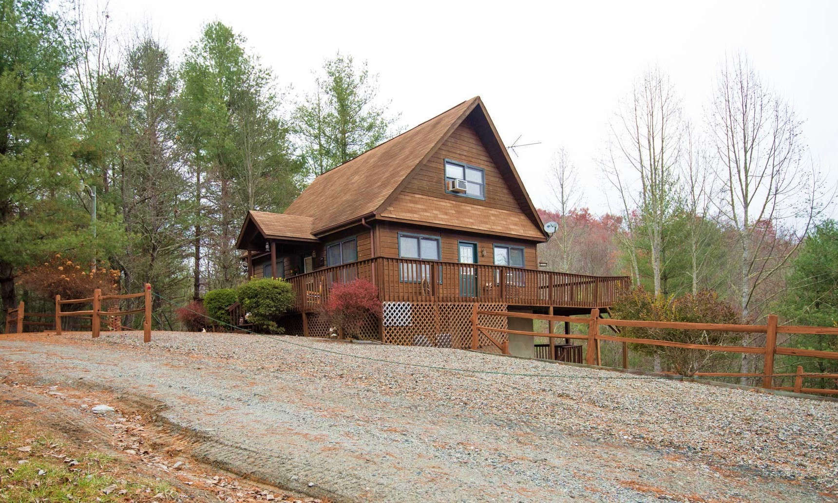 BLUERIDGE MOUNTAIN CABIN nestled on a peaceful .82 acre setting on Happy Forest Drive in the River Lake community of Piney Creek in Alleghany County, this 2-bedroom, plus bonus room, 2-bath cabin is a great option for your mountain retreat or primary residence.