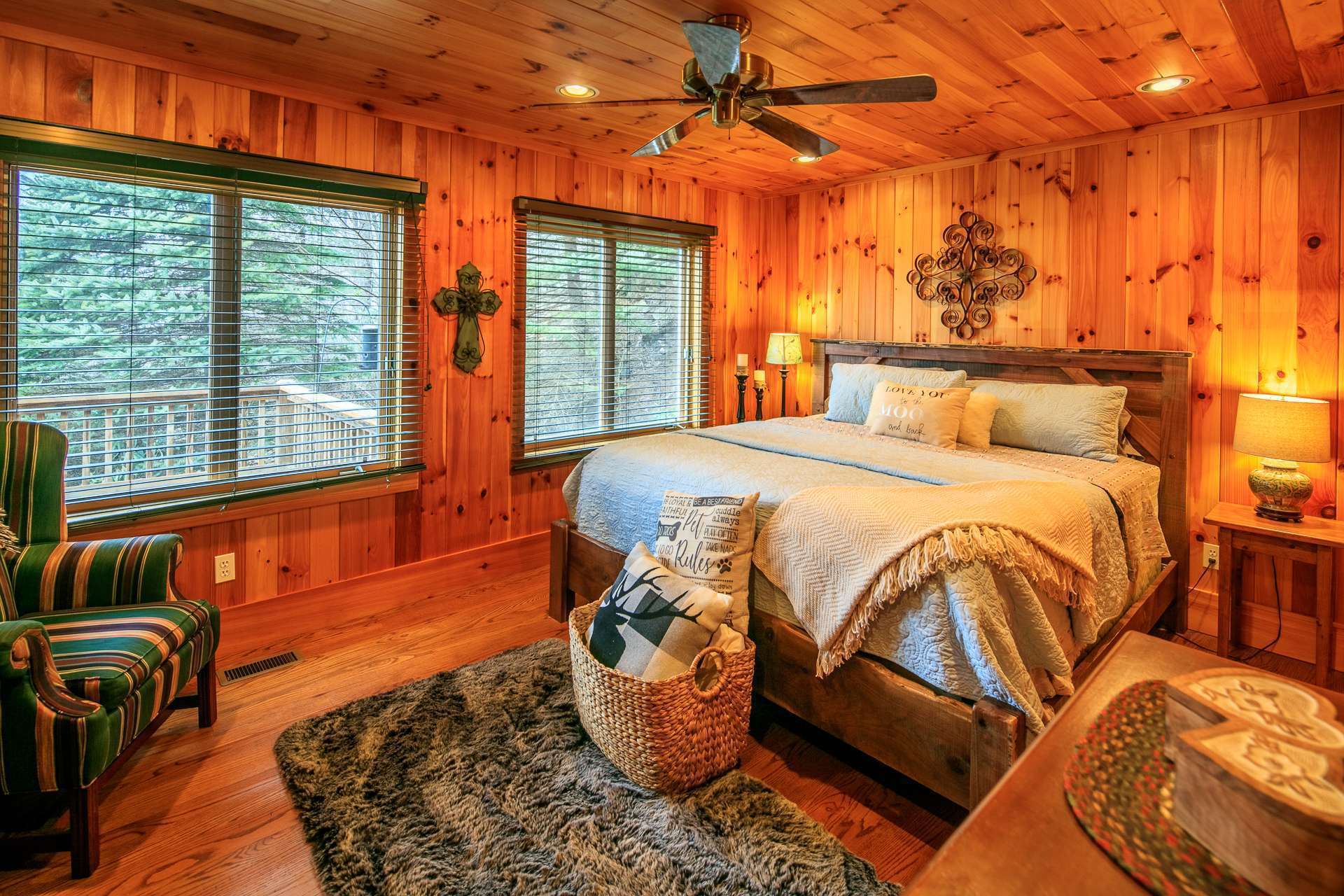 The main level master suite offers a private bath and plenty of windows  to enjoy the outdoor scenery.