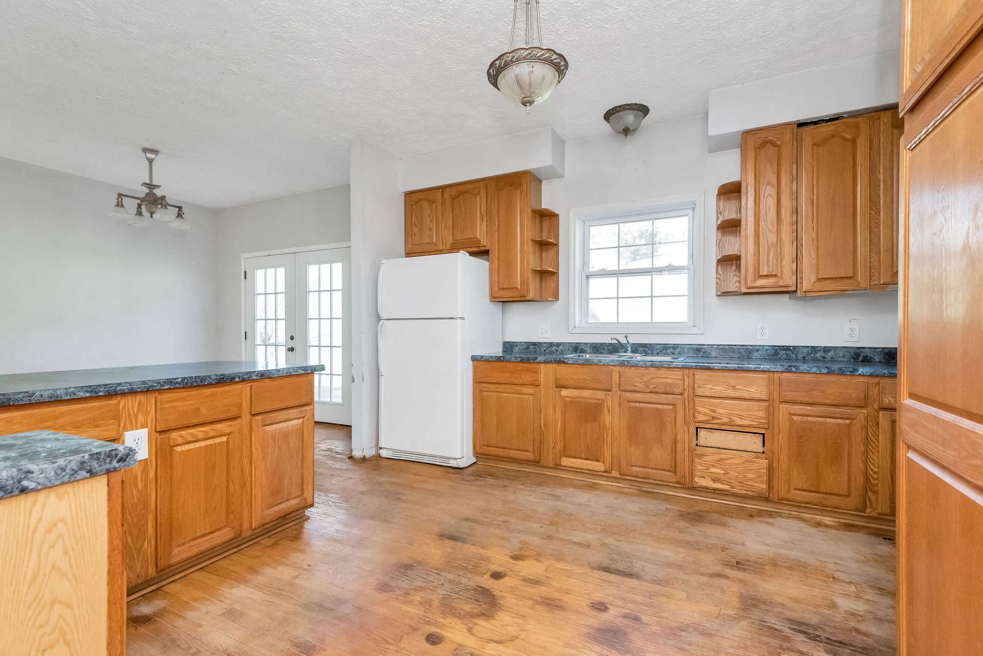 The kitchen provides ample counter and cabinet space, perfect for culinary enthusiasts.