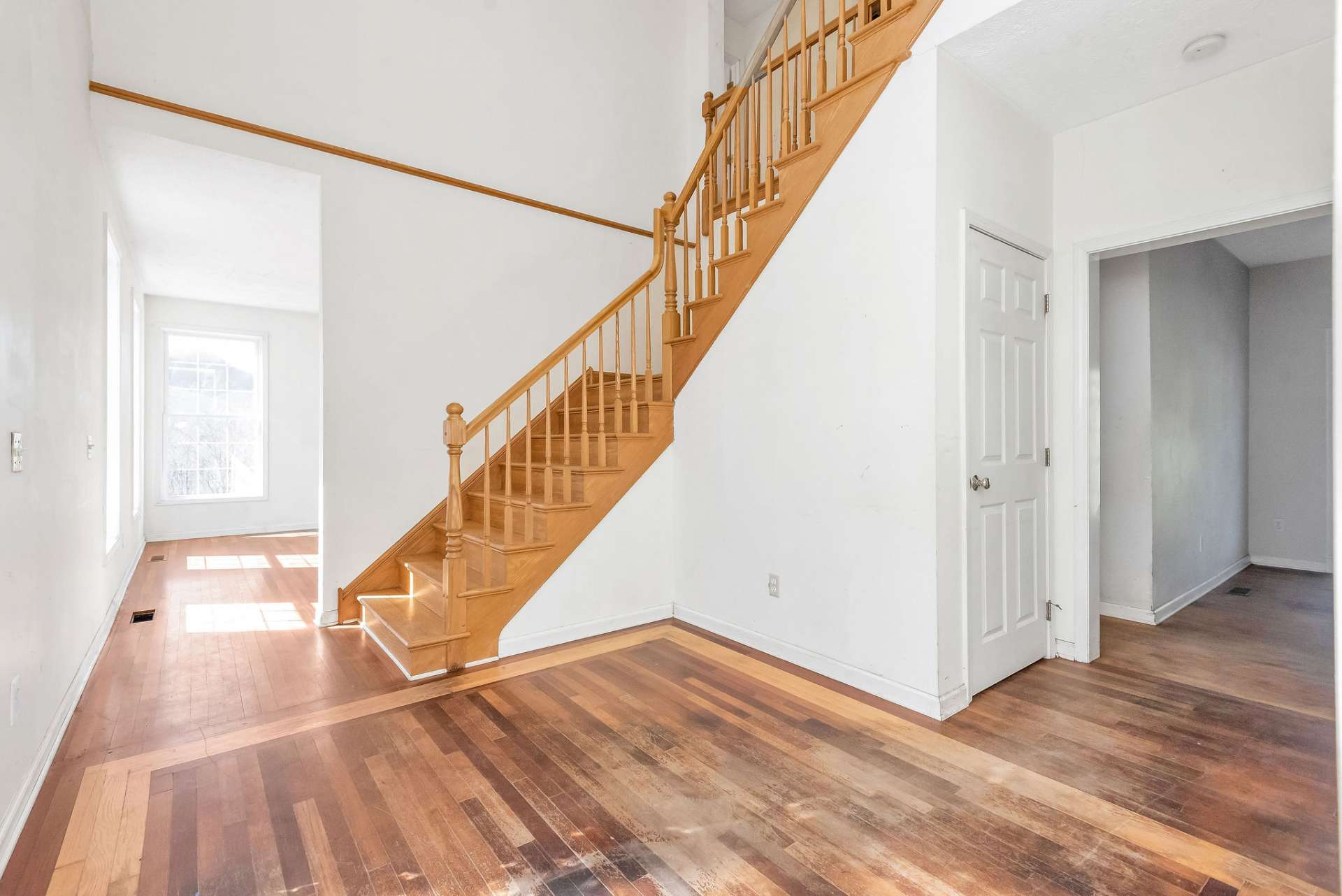 Underneath the staircase is the interior access to the unfinished basement.