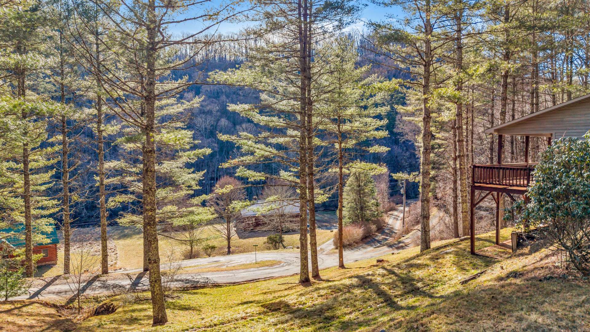 Enjoy mountain and creek views from the covered deck