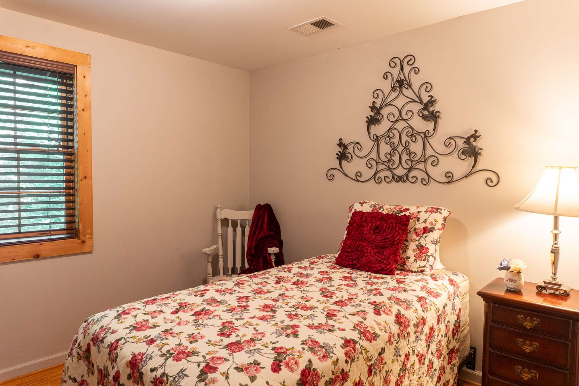 A charming guest bedroom and a full bath complete the main level.