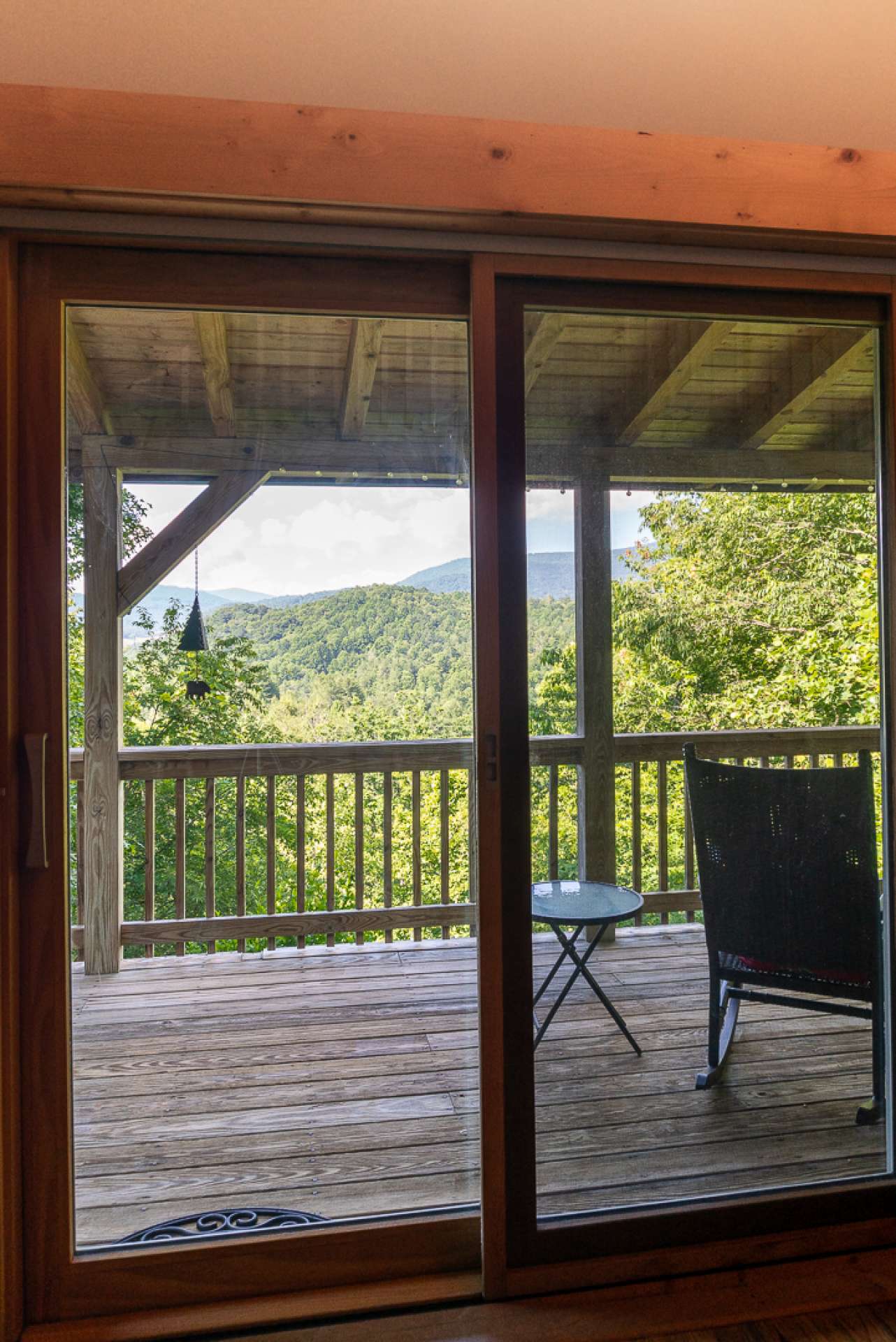 The living area also offers access to the covered deck and allows you to enjoy the views through all four seasons in the Blue Ridge Mountains of North Carolina.