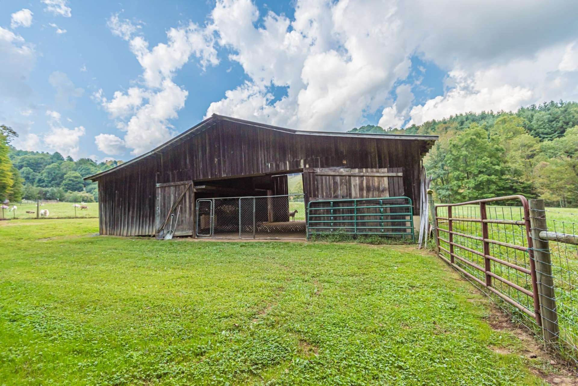 A well built barn with paddocks will accommodate livestock and equipment.