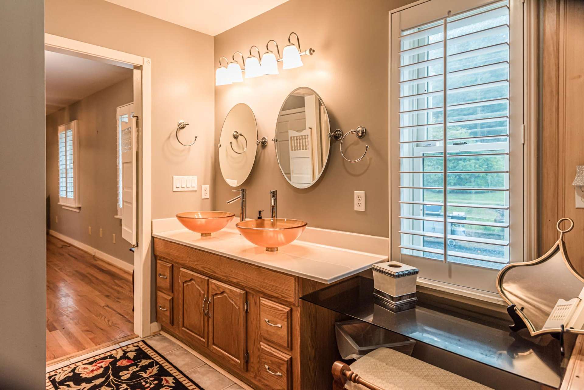 The master bath offers a double vanity, jetted tub, and separate shower.