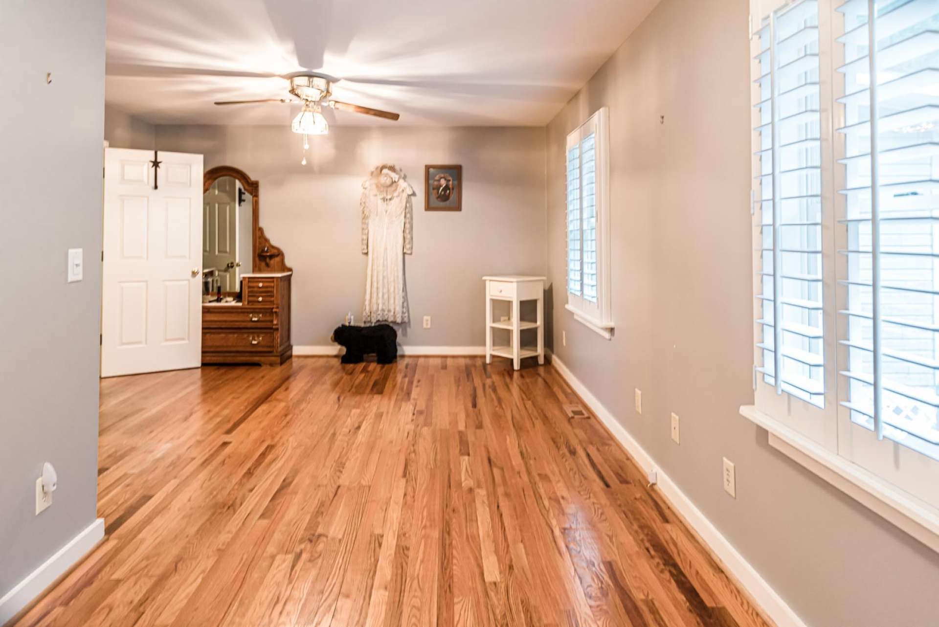 The master bedroom features gleaming wood floors, lots of windows, and a private master bath.