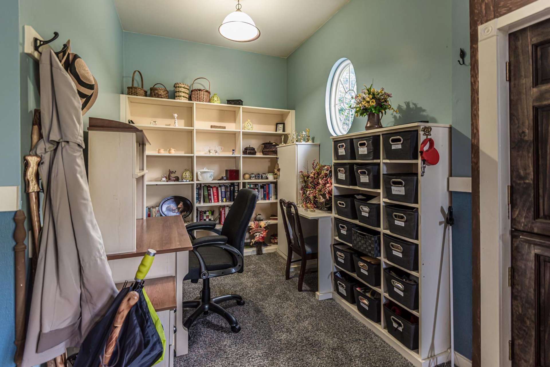 From the den area, this well organized office is perfect for a home-based business.