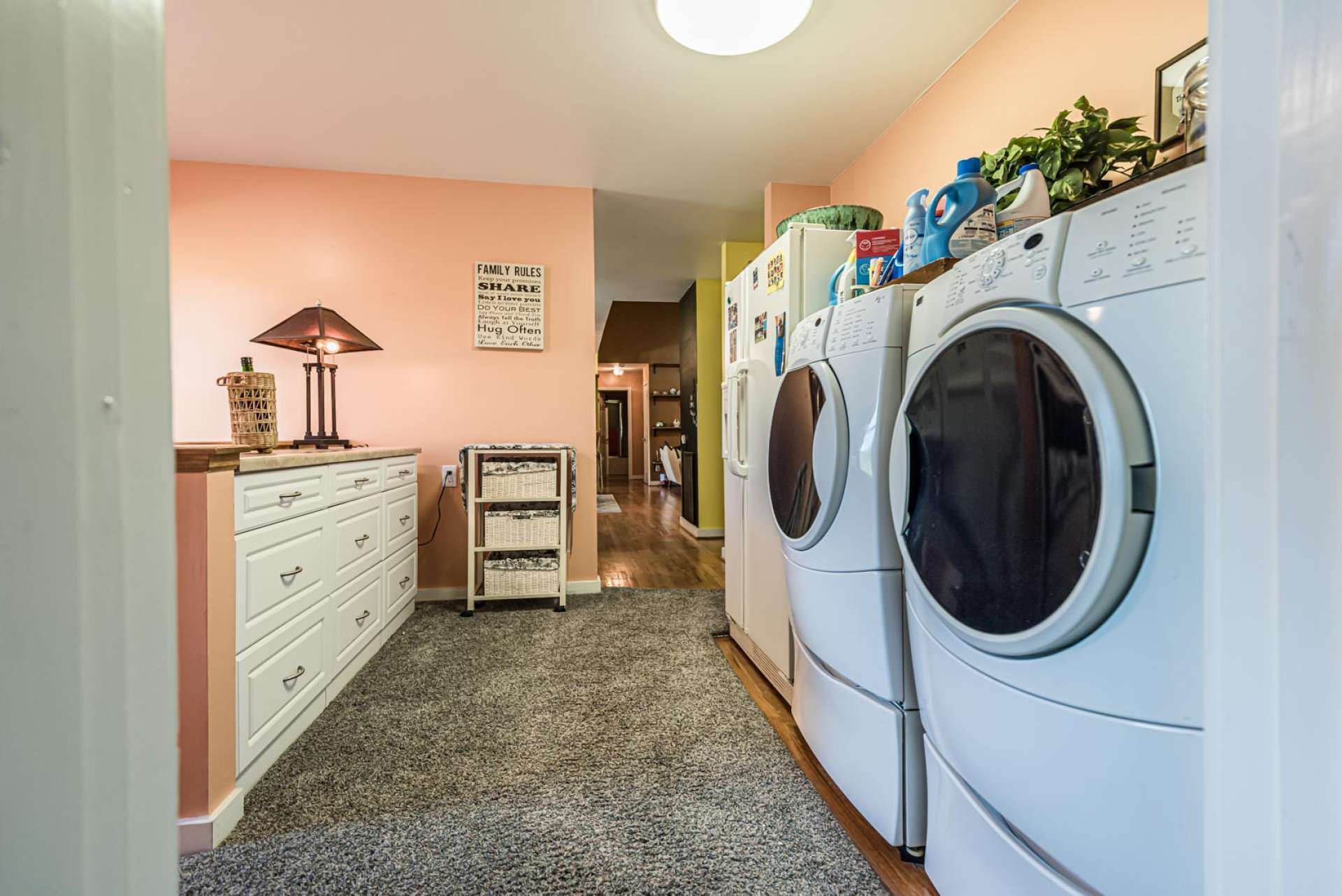 Just off of the kitchen, is a spacious laundry room.