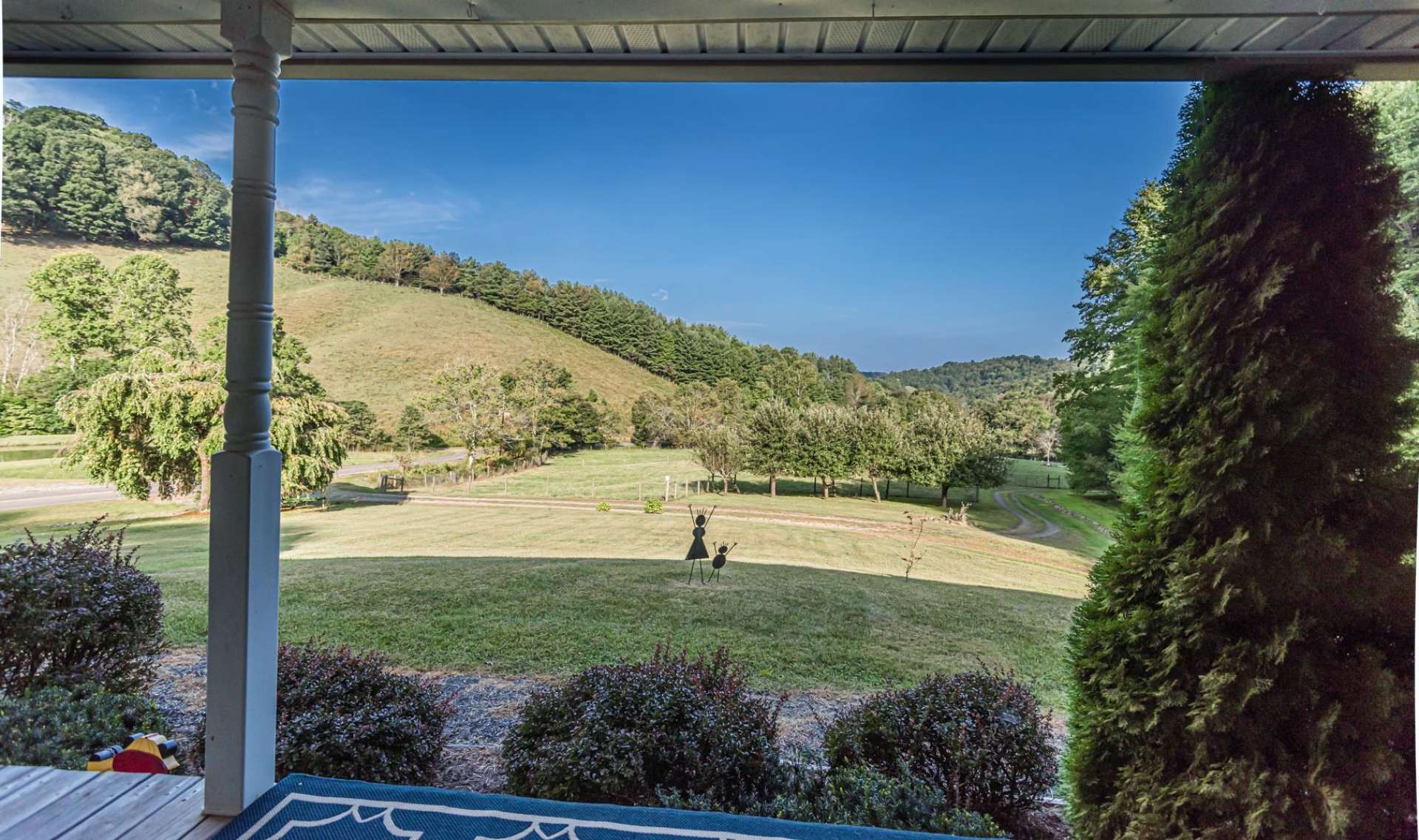 A covered front porch offers the ideal spot to relax with the views and fresh mountain breezes. Nothing like overlooking your own "Ponderosa."