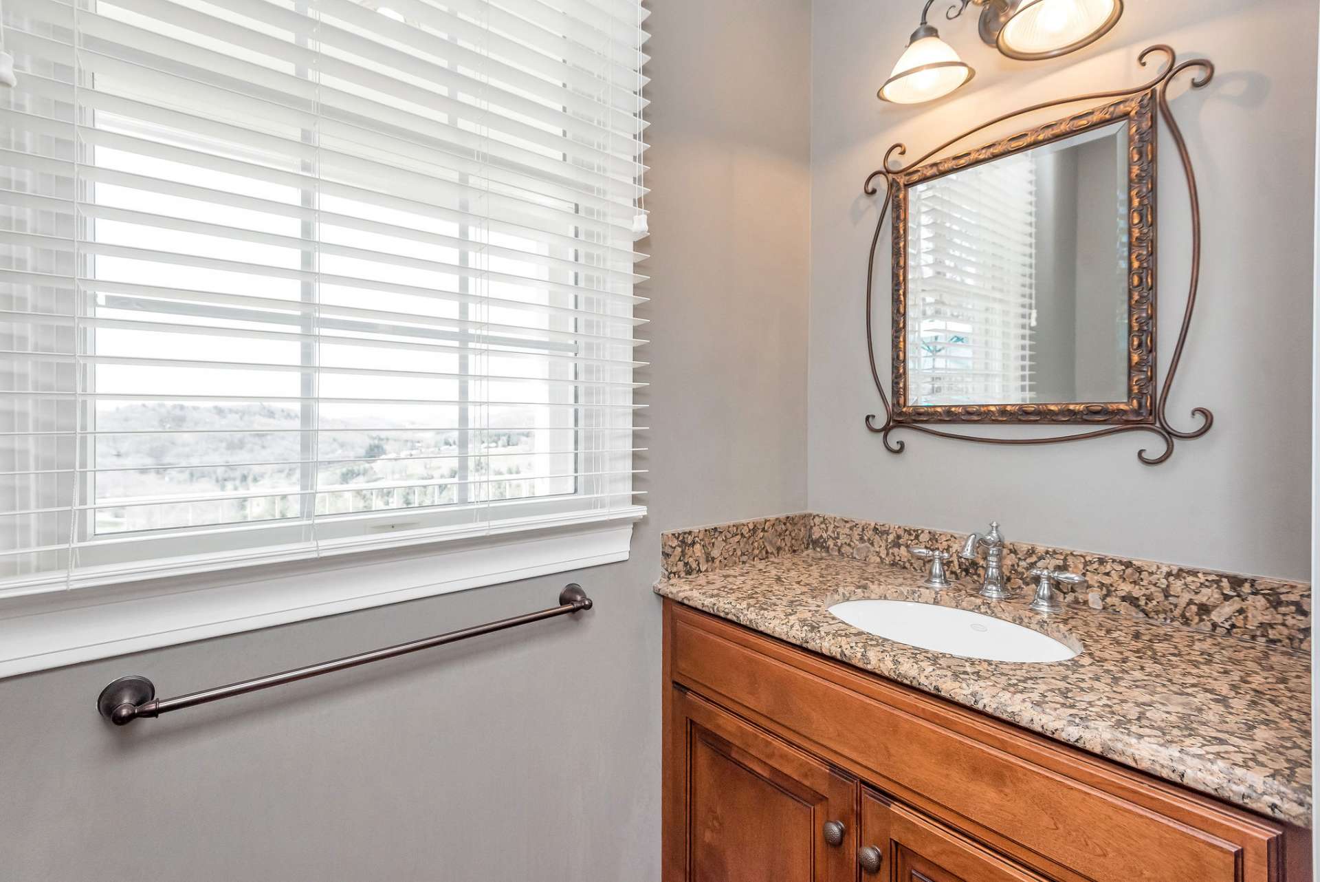 Powder room, conveniently nestled just off the kitchen, providing easy access for guests and residents alike.
