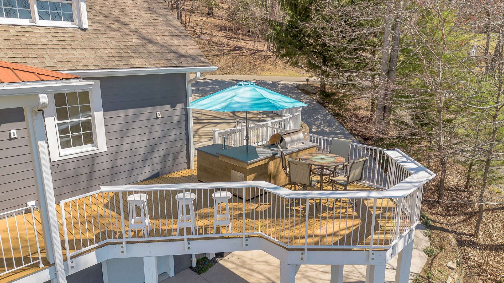Recently expanded, the open section of the deck has been thoughtfully designed to maximize outdoor living space and enhance the overall functionality of the area. Here, you'll find a state-of-the-art outdoor kitchen offering the ultimate in outdoor culinary convenience and luxury.