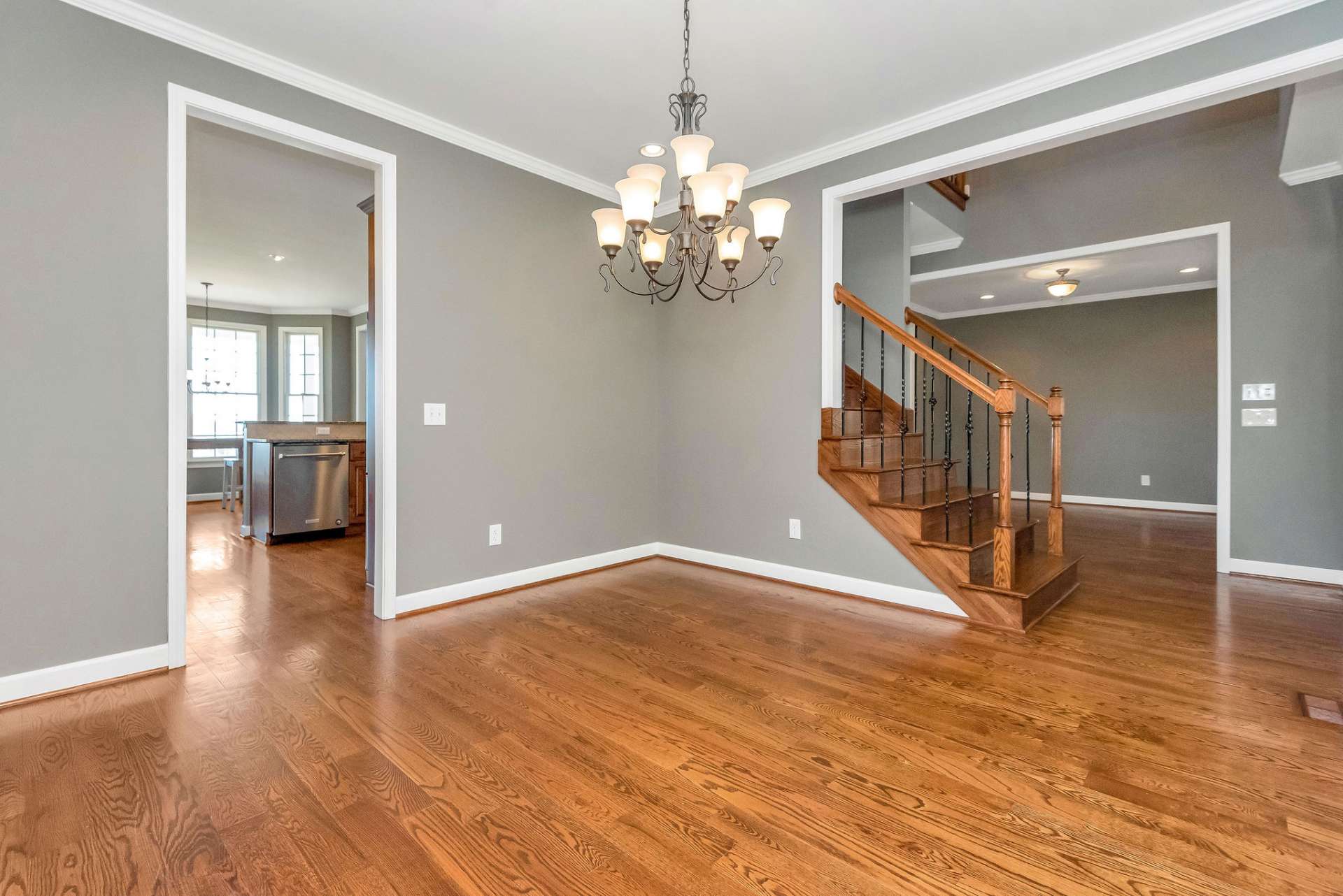 The elegant dining room is accessible from both the vestibule and the kitchen, creating a seamless flow for entertaining and everyday living.