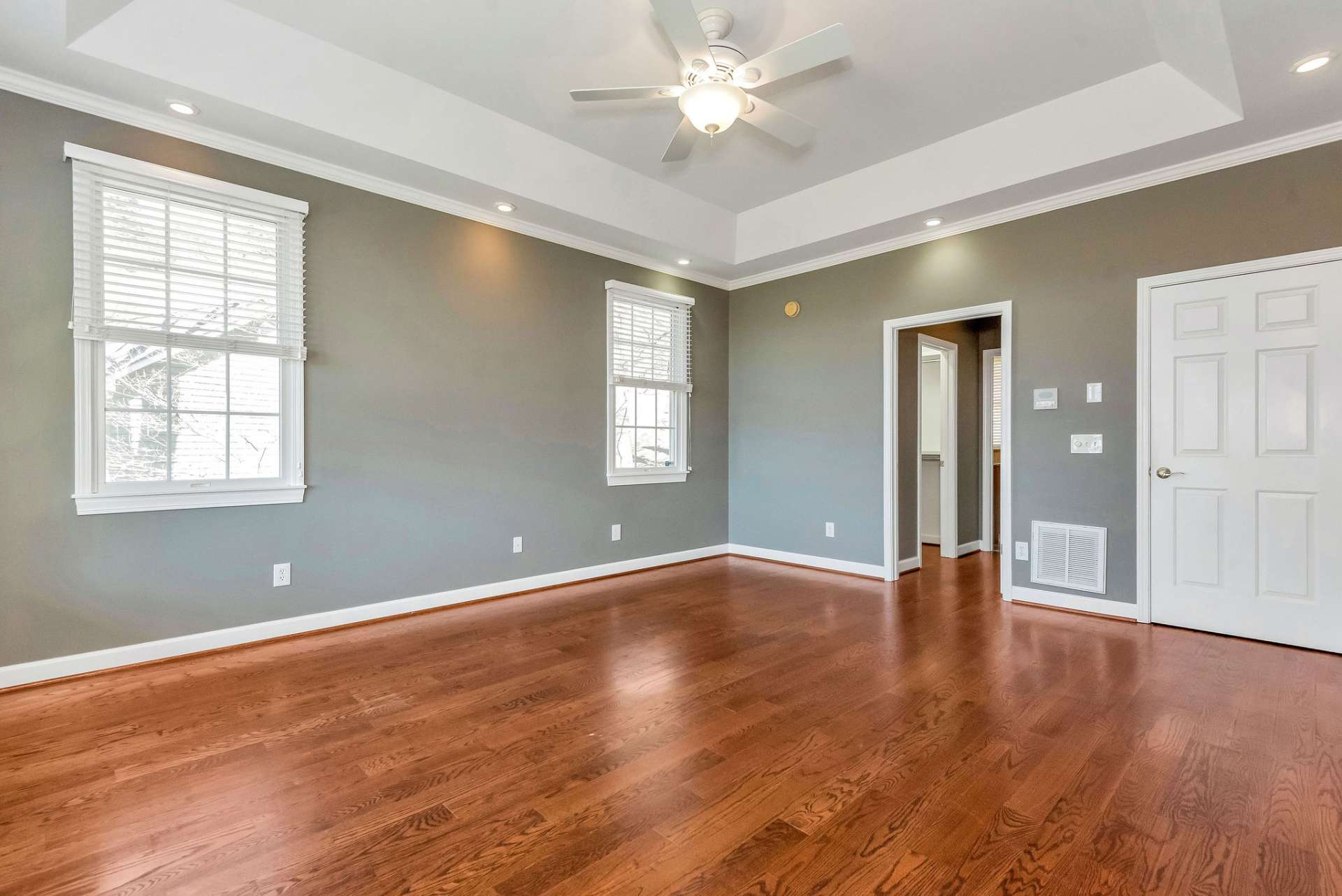 The focal point of the primary bedroom is the tray ceiling, adding architectural interest and sophistication to the space.