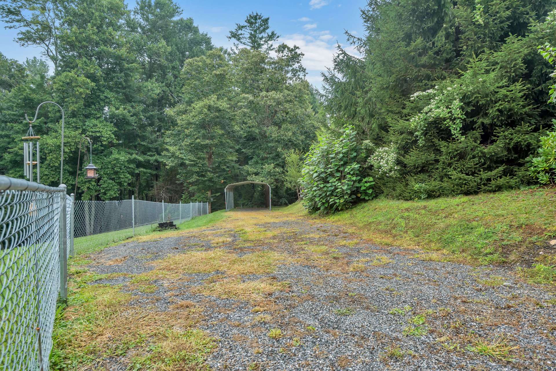 Covered parking area behind the house!