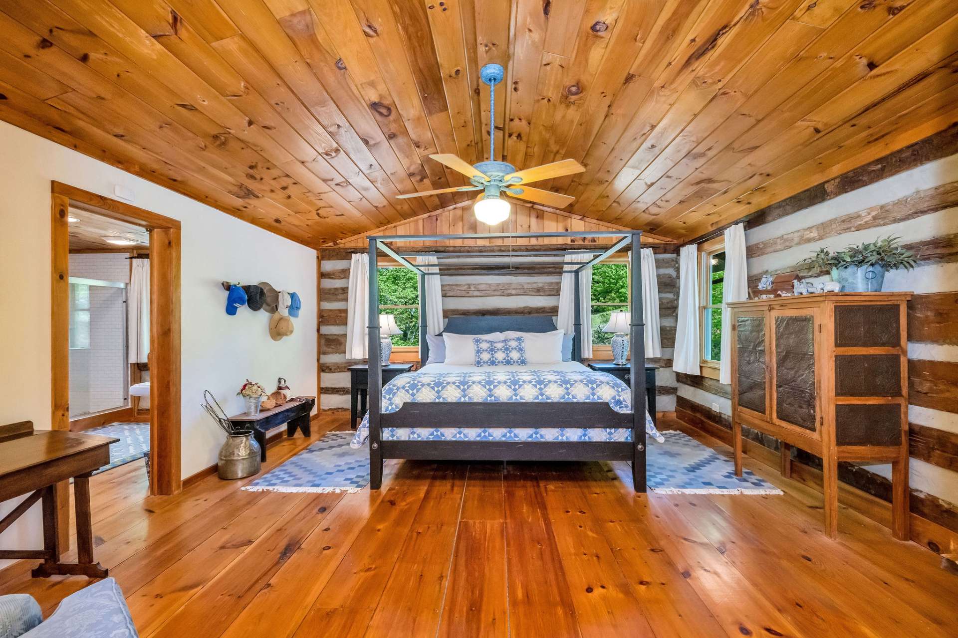 The vaulted ceiling invites light from the numerous windows to cascade throughout the room, adding to its bright and airy feel.