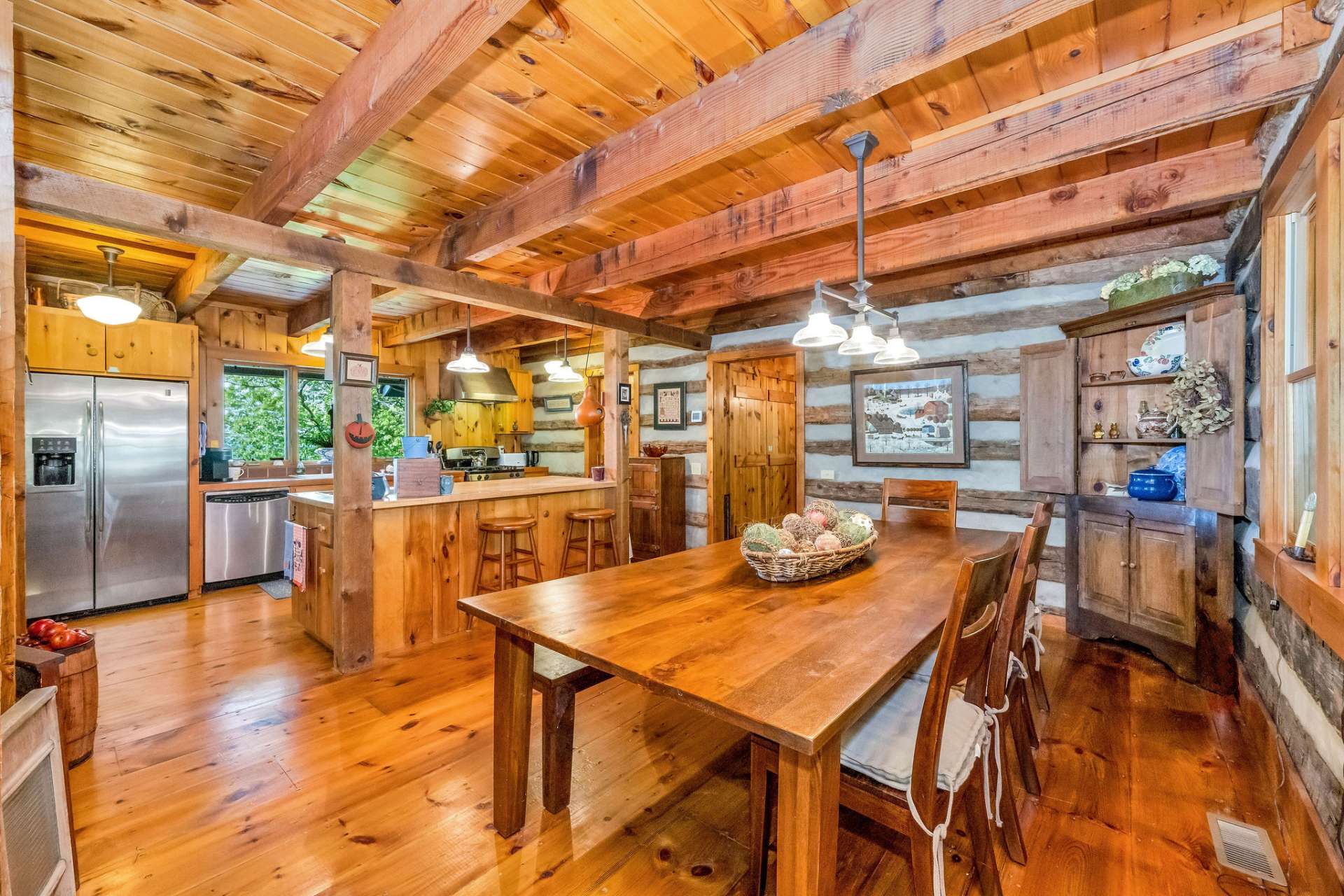 Rich warm hues meet cool, calming accents, crafting a one-of-a-kind ambiance only an antique log cabin can deliver.