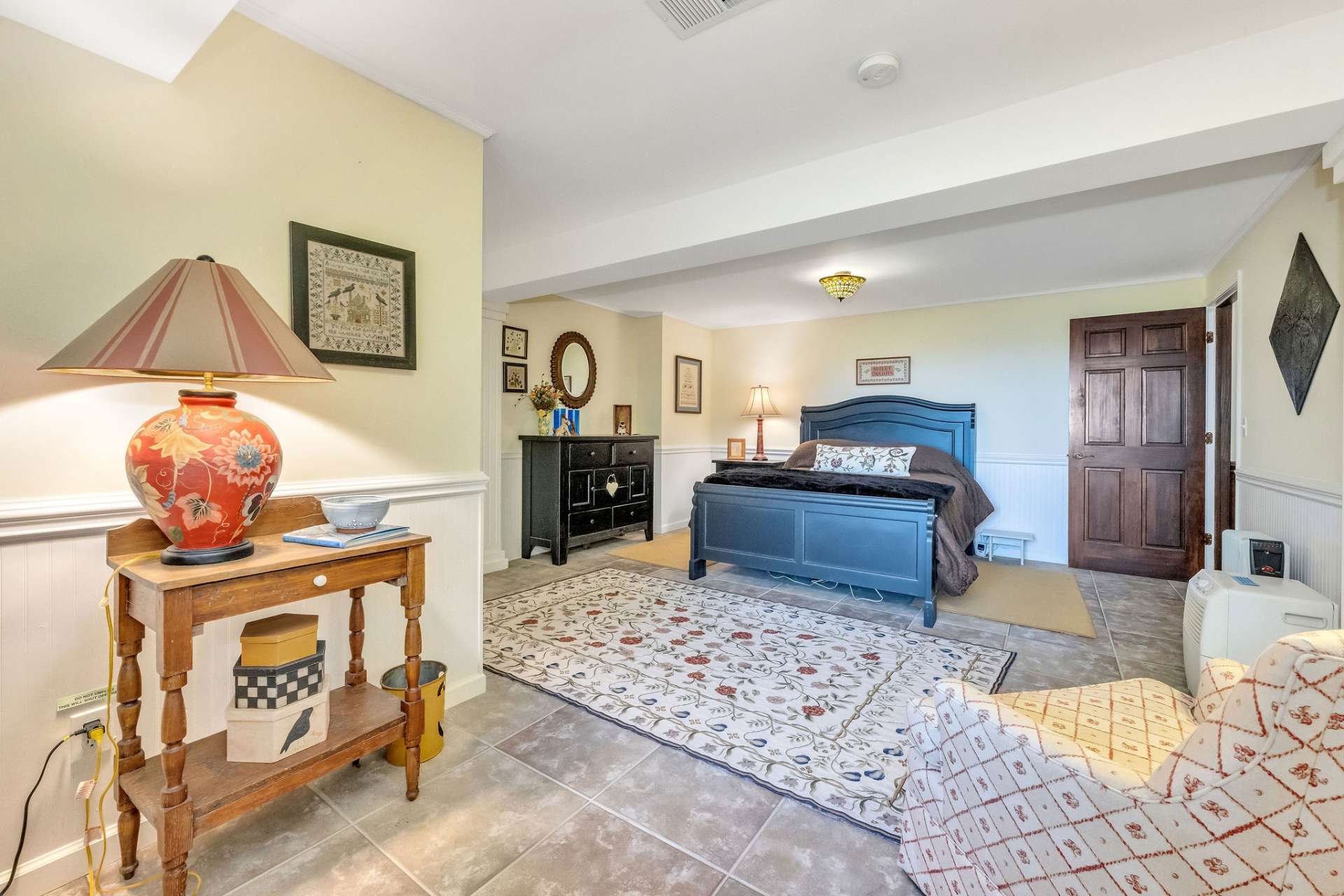 The lower level bedroom is spacious, bright, and cheery.