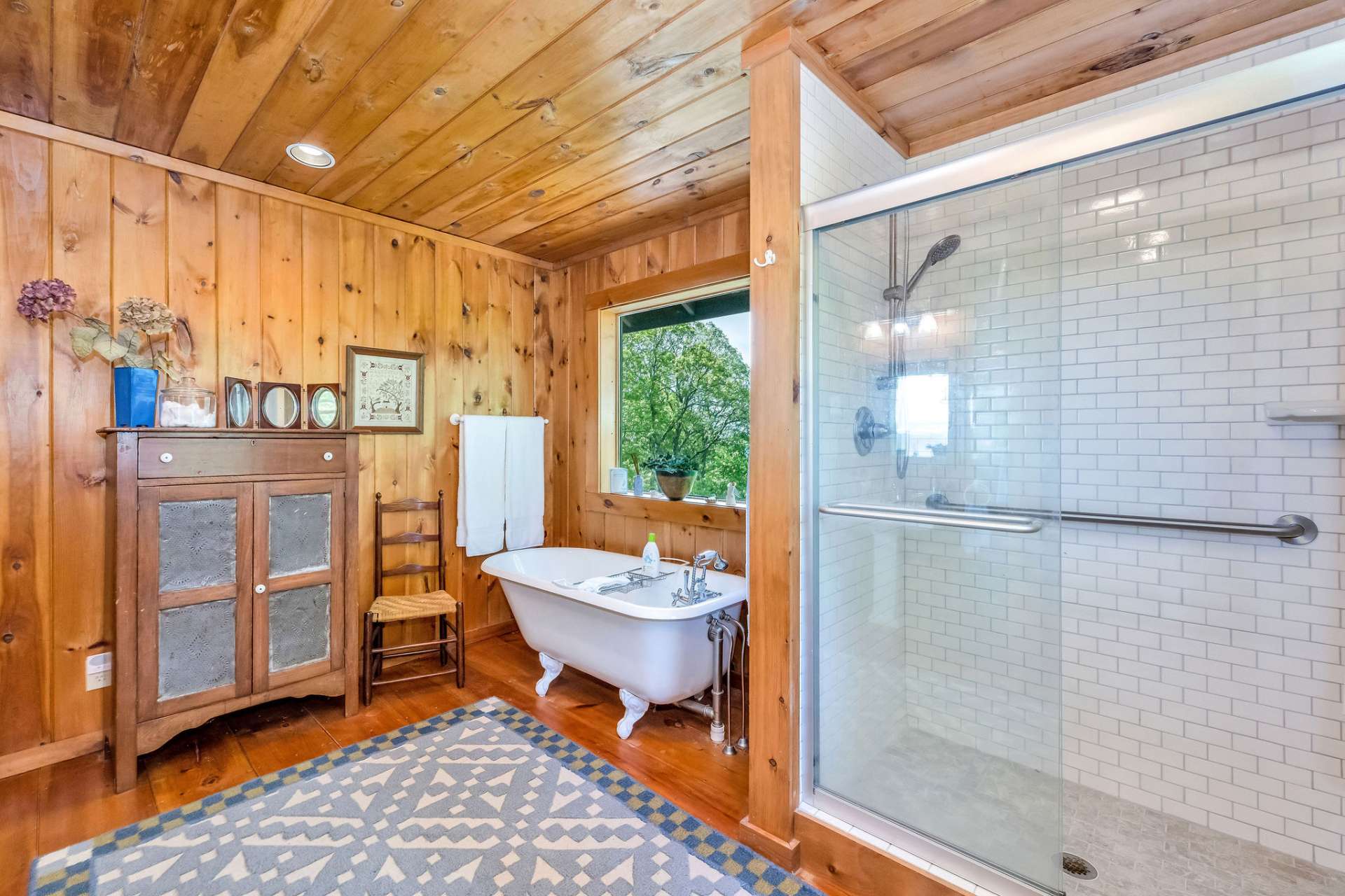 An updated tile shower adds a sleek, modern touch to this thoughtfully designed bath.