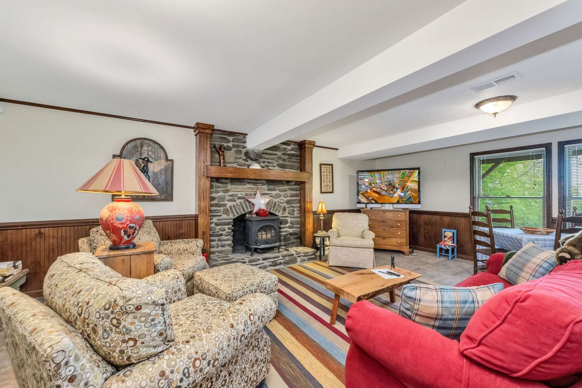 This room features a second fireplace with a wood stove insert.