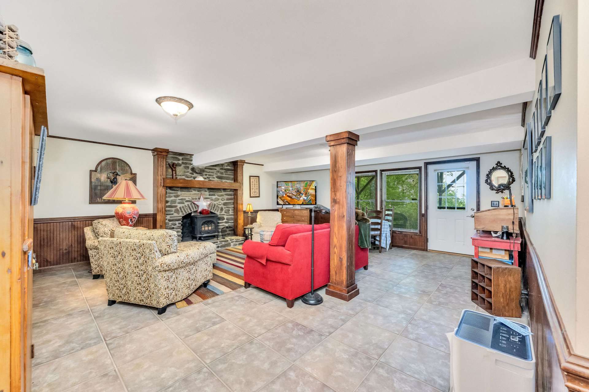 The lower-level family room creates space to unwind with access to the patio.
