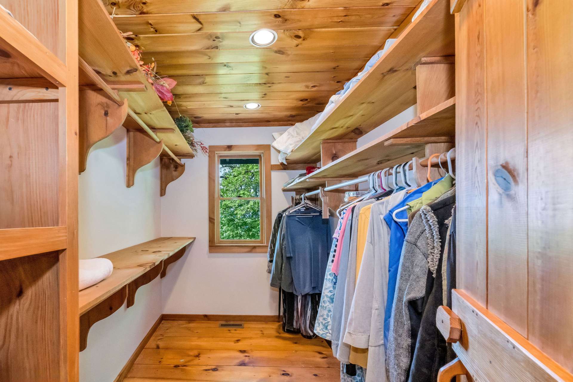 In Stonebridge, a closet like this is a rare luxury, enhanced by a window that brings in both natural light and a scenic glimpse of the outdoors.