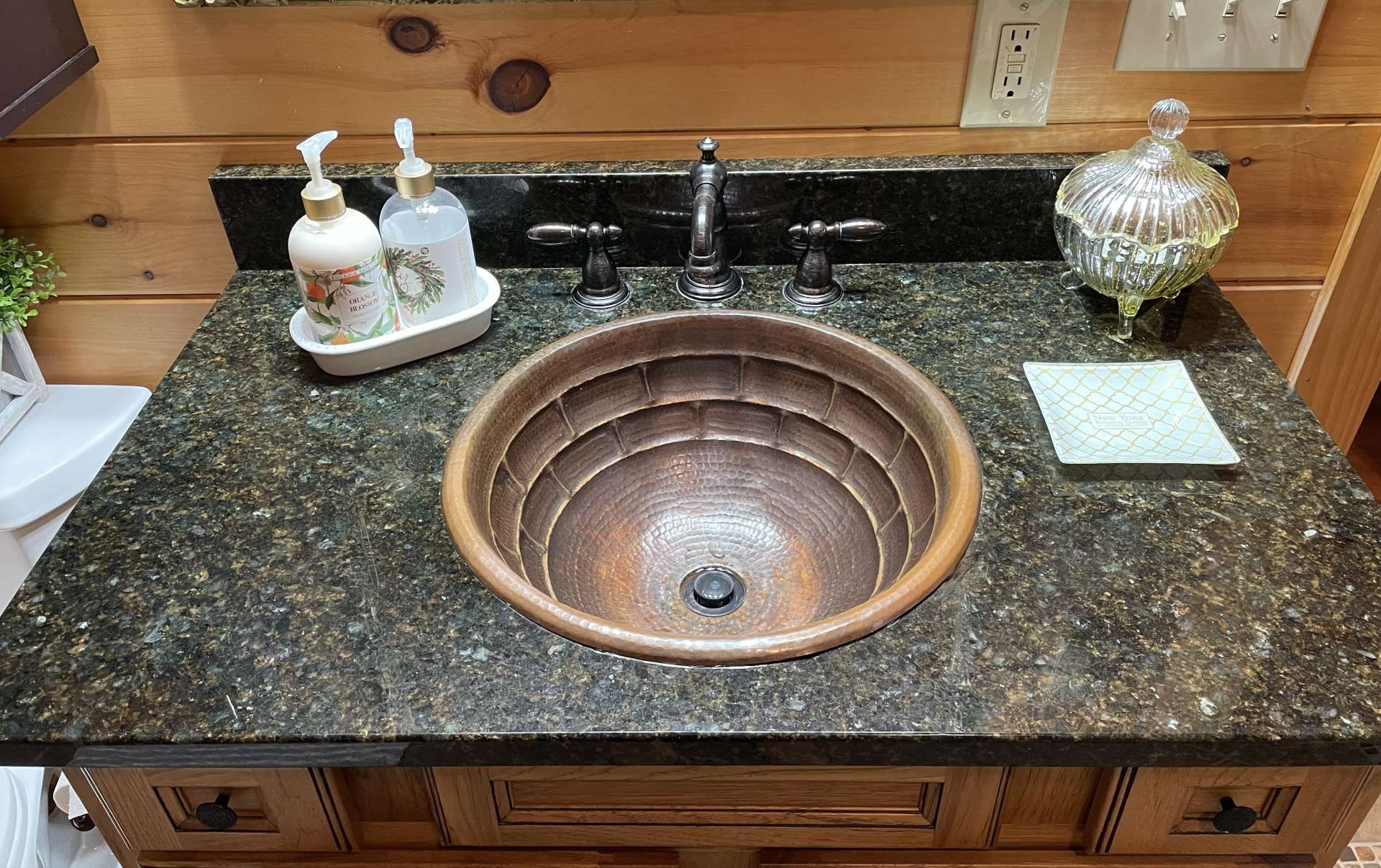 Hammered copper sink in the primary bath.