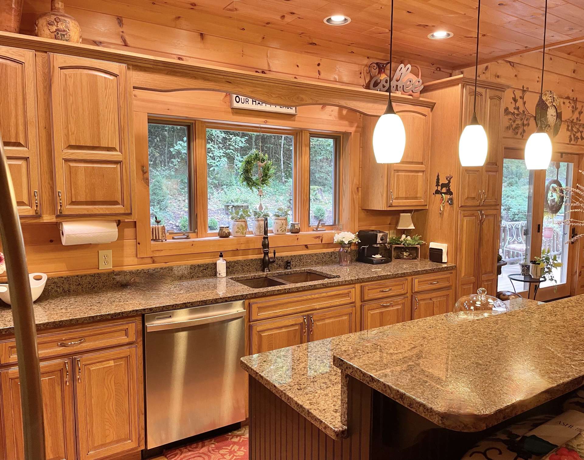 Kitchen with granite countertops and stainless appliances.