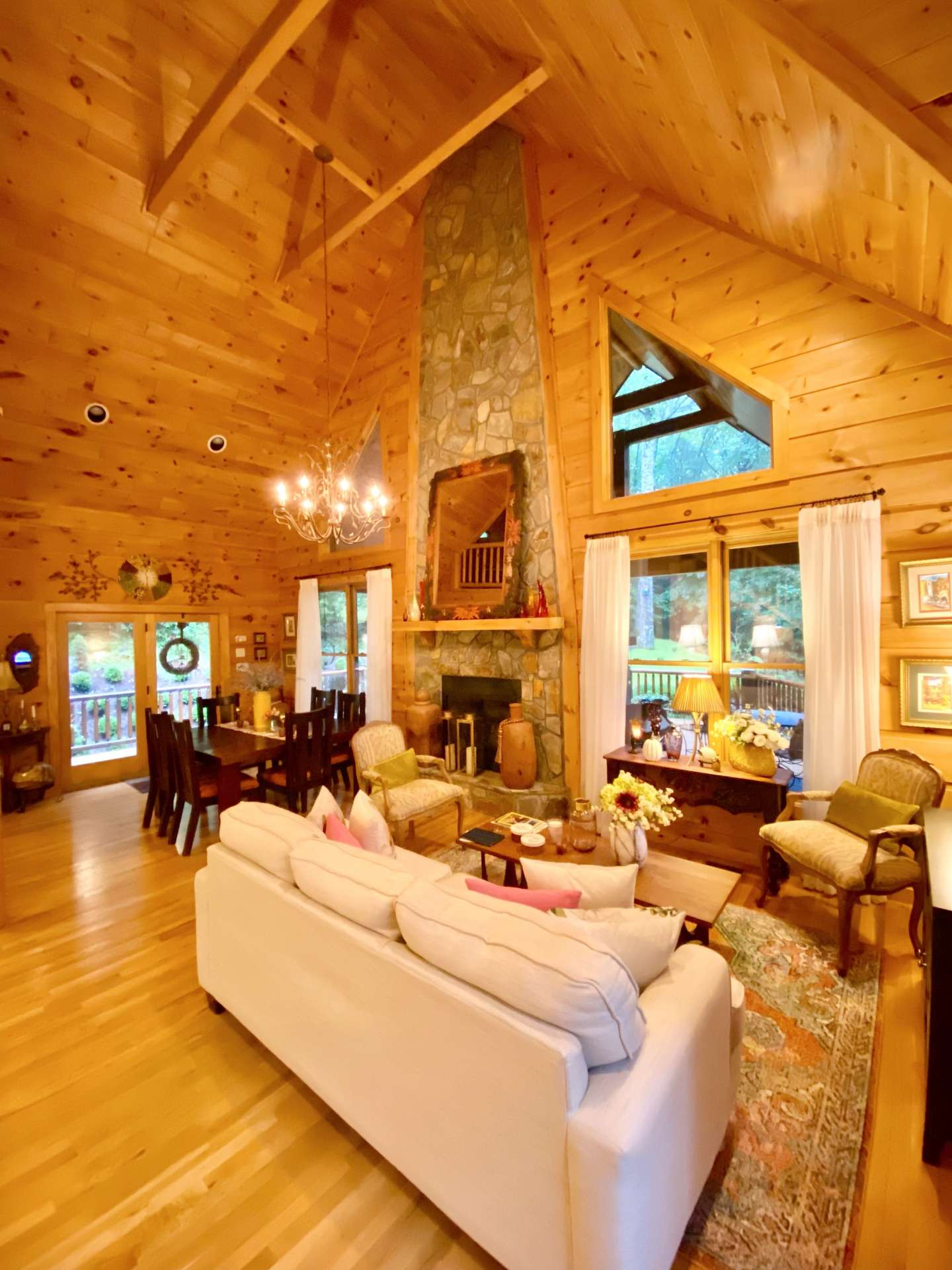 Vaulted ceilings and a wall of windows to enhance the open floor plan and fills the cabin with natural light.