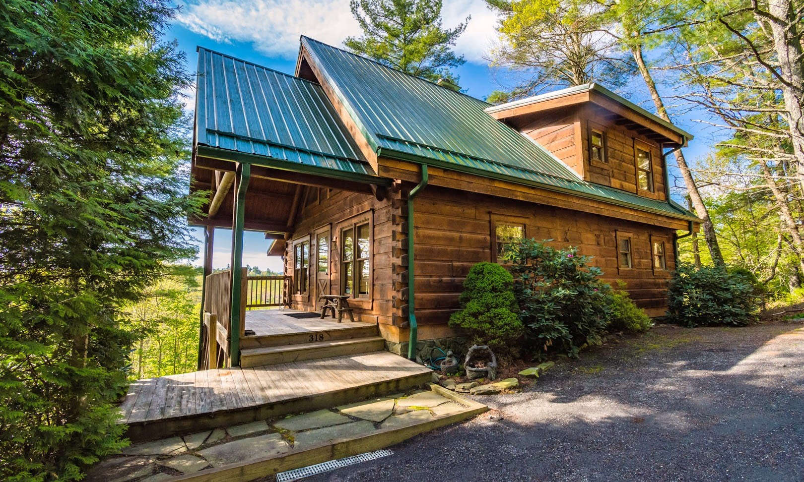 This 3-bedroom, plus bonus room currently utilized as 4th bedroom, 3.5-bath log cabin is located in Blue Ridge Manor, a well established community conveniently located close to the New River between West Jefferson and the Blue Ridge Parkway.