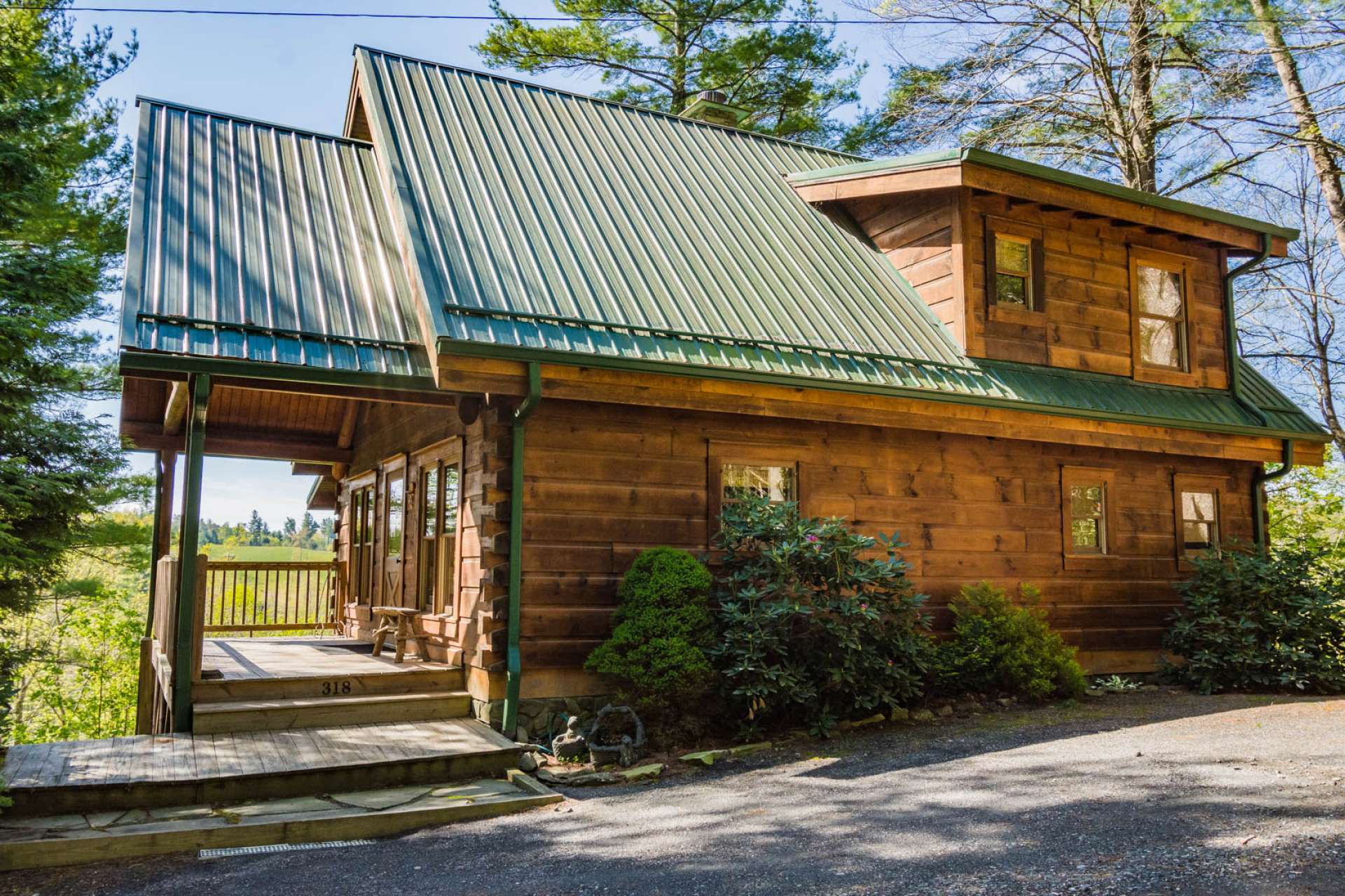 This sweet log cabin is hidden away in a wooded setting overlooking the New River and located within a short drive into downtown West Jefferson, Boone, and many high country destinations. The ideal option for your mountain and river retreat!