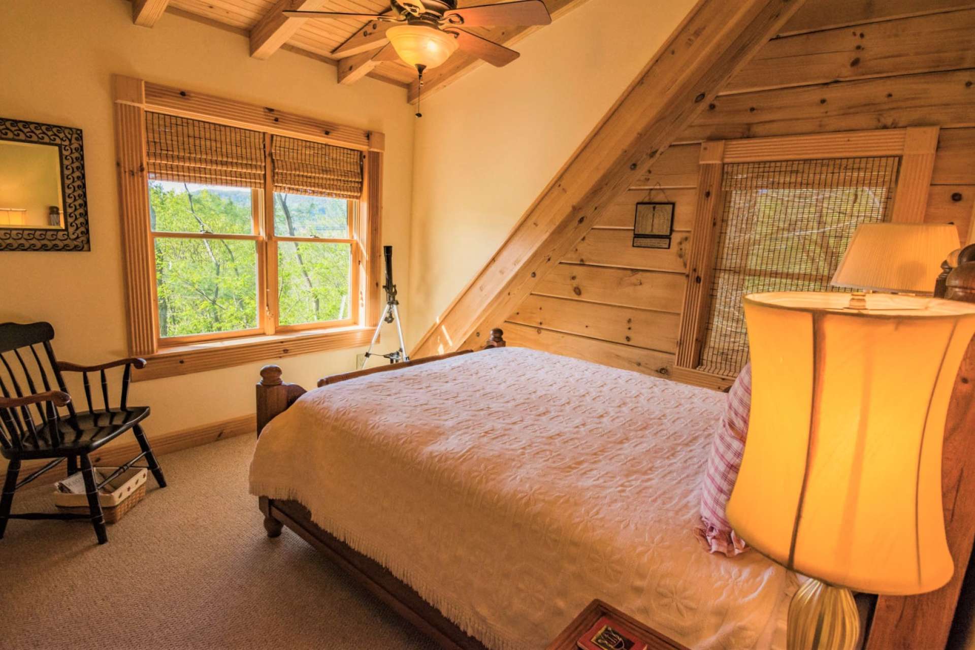 There are two guest bedrooms and a full bath on the upper level. Your guests can enjoy the views and architectural accents.