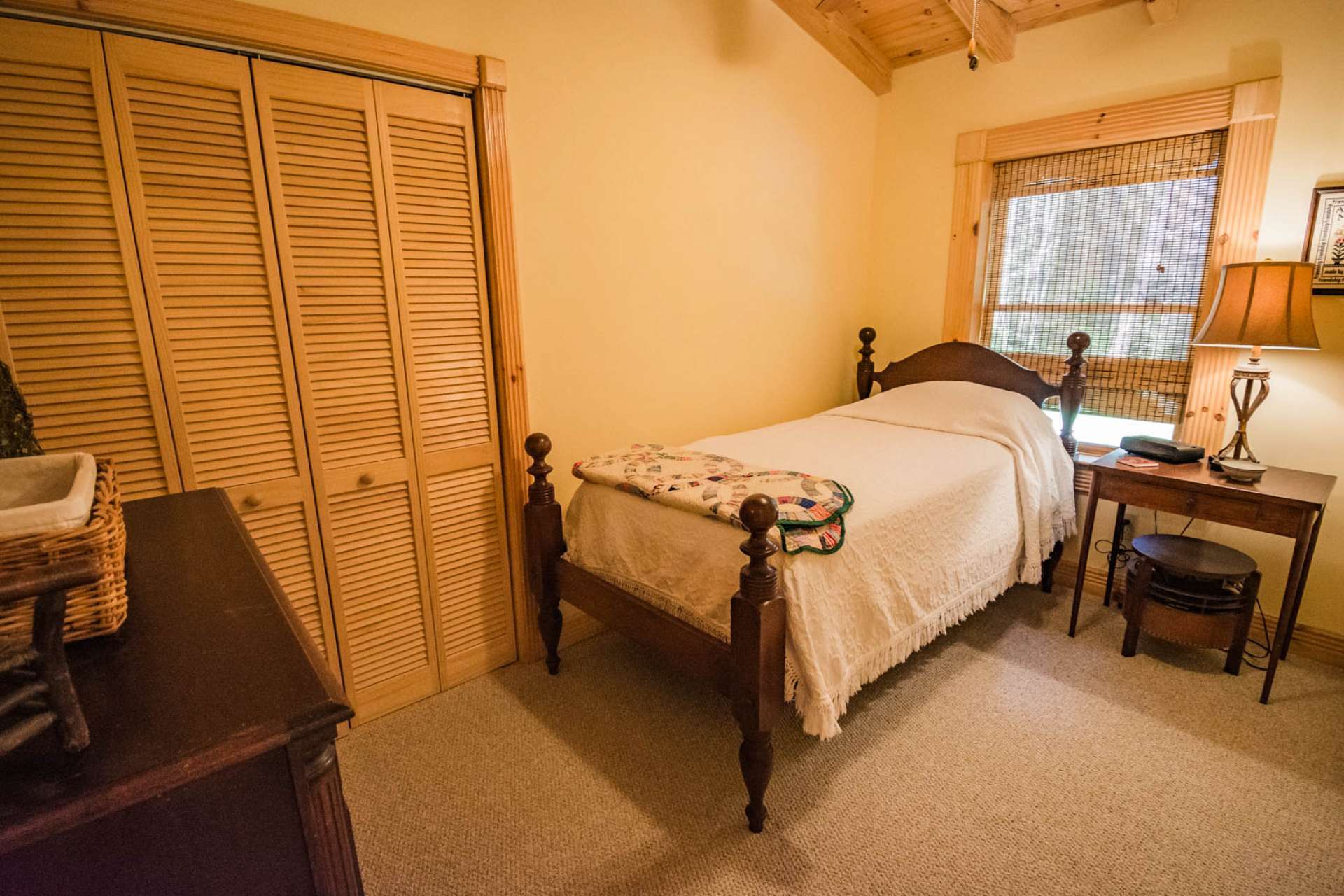 Both upper level bedrooms are generously sized and feature vaulted ceilings and carpeted floors.