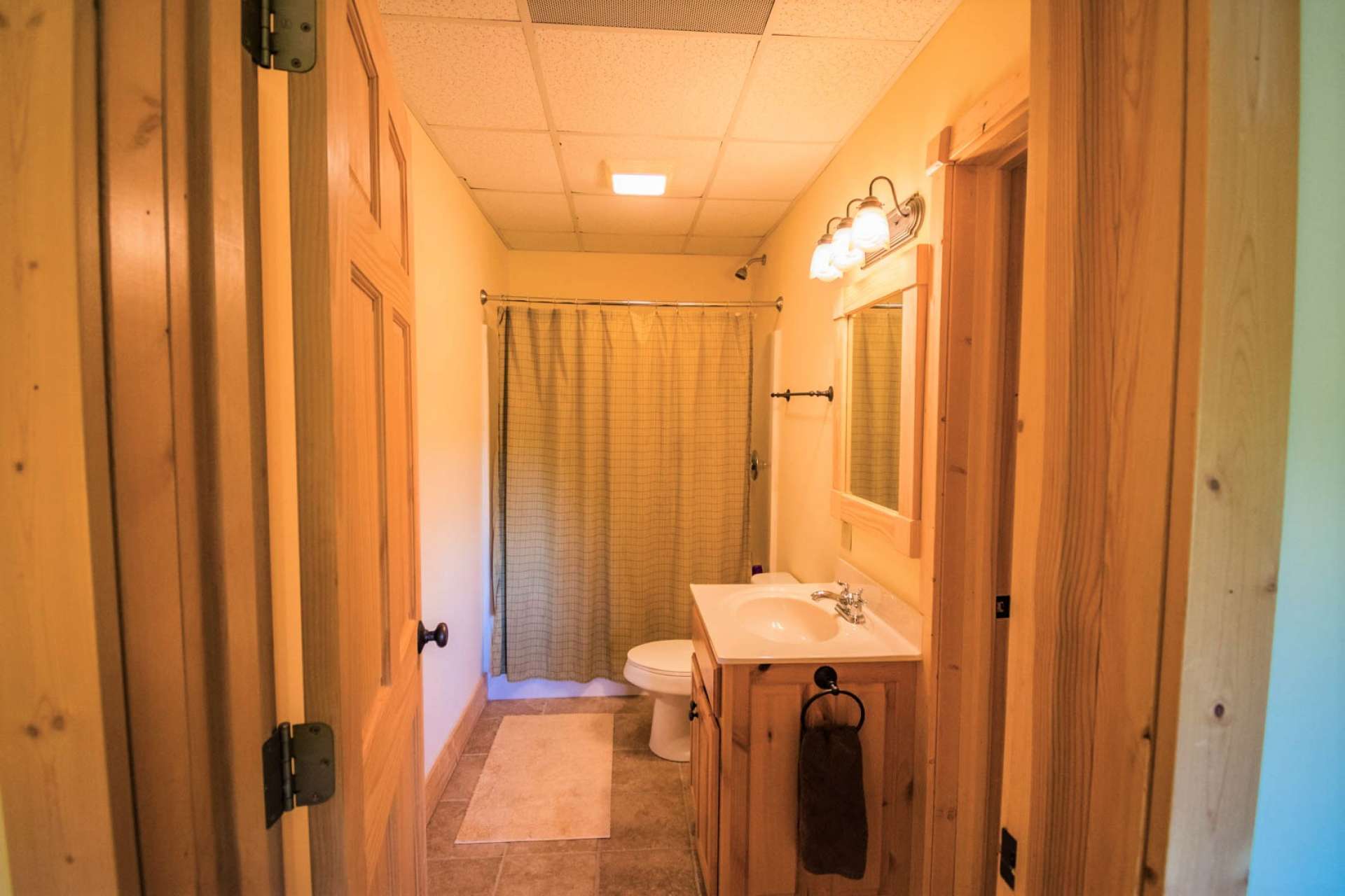 A full bath with ceramic tile floor completes the lower level floor plan.