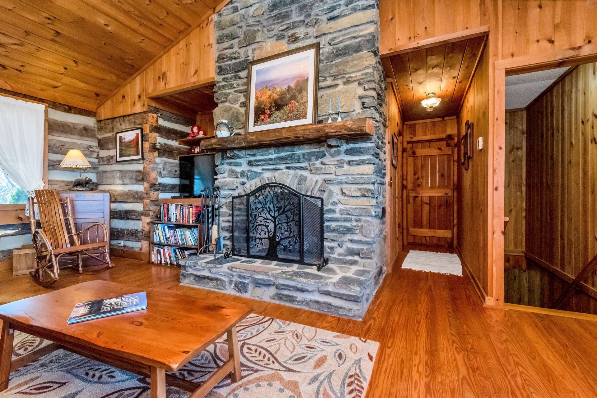 Native stone fireplace is the heart of this Stonebridge cabin.