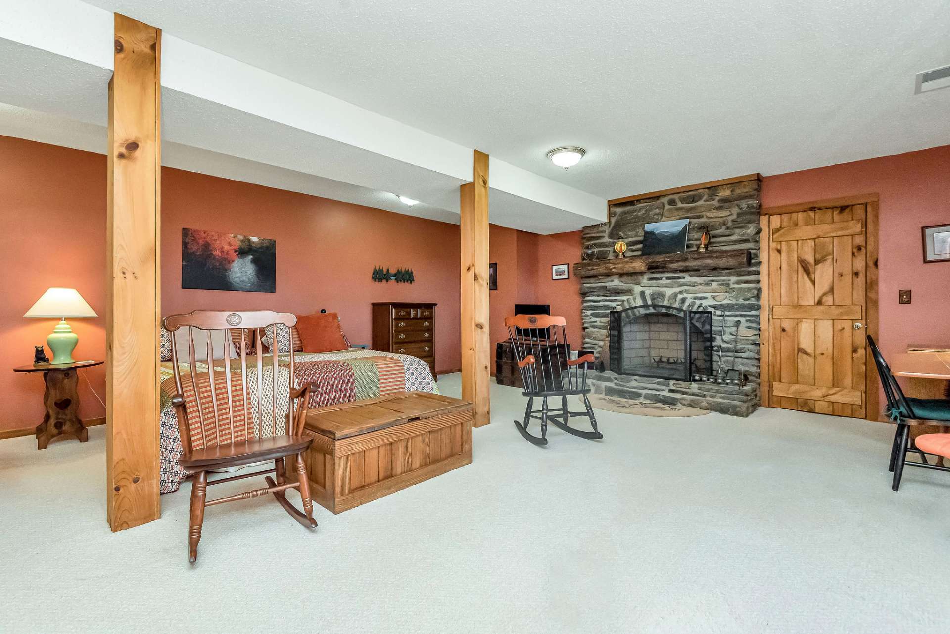 The family room welcomes you with a second stone fireplace.