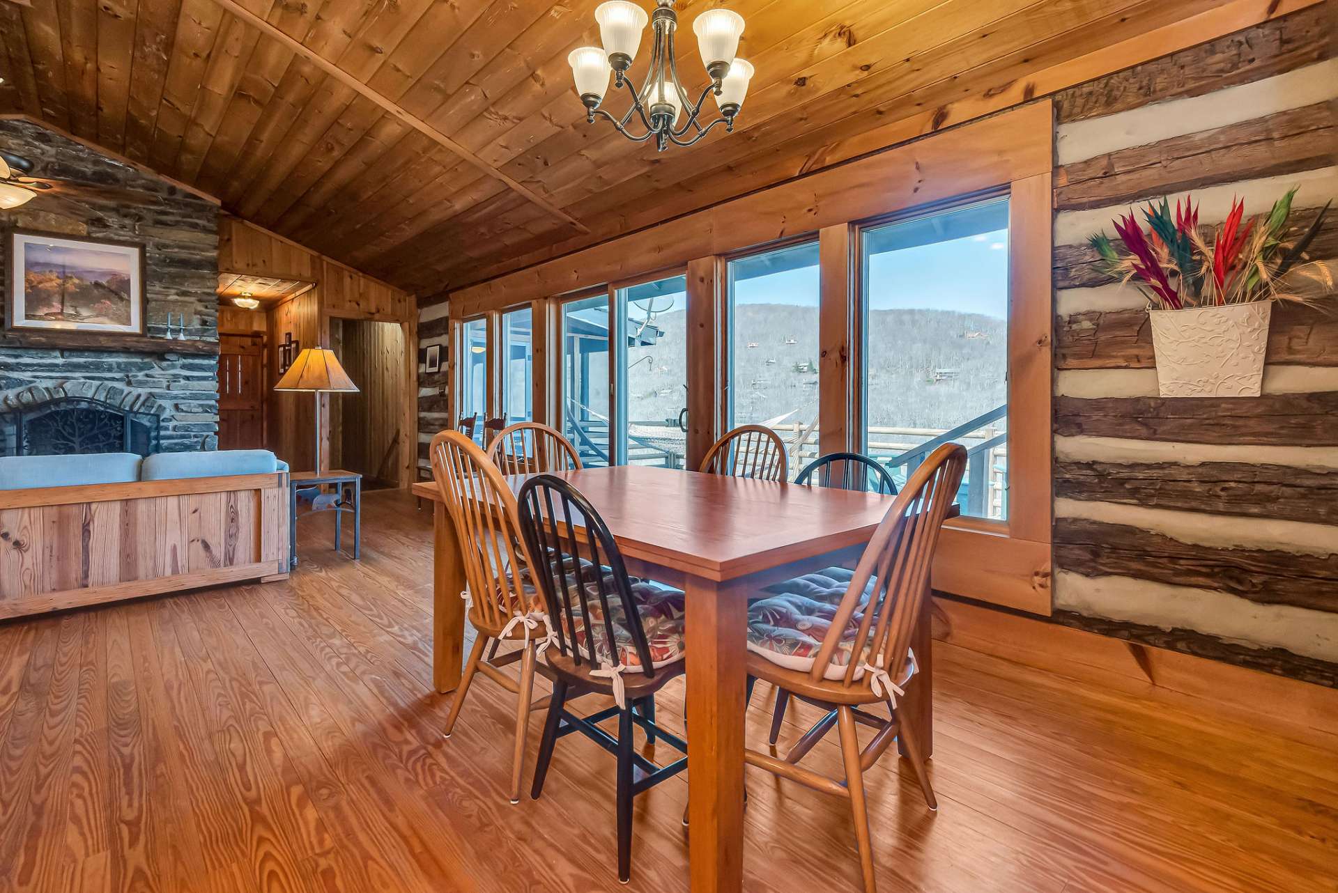 The dining area is filled with natural light and views from every angle.