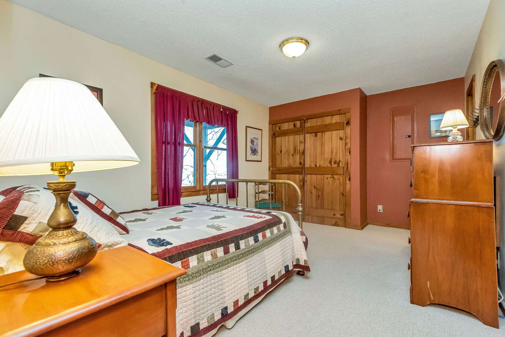 The lower-level guest bedroom offers comfort & convenience for guests or family members alike.