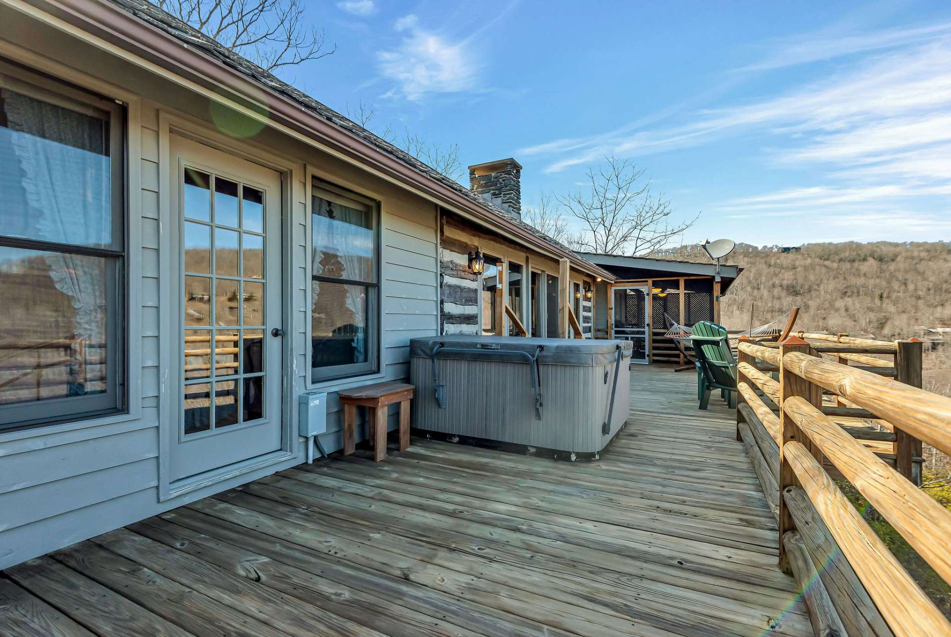 Step out onto the open deck to soak in the hot tub under the stars.
