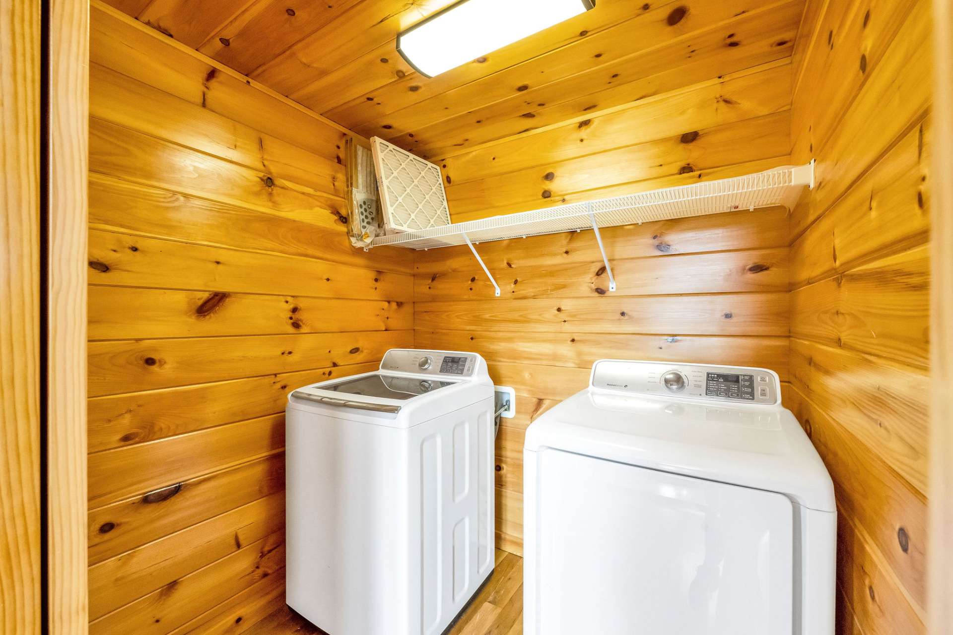 Tucked conveniently off the living area, the laundry closet features a sleek Samsung washer and dryer—practicality meets modern performance.