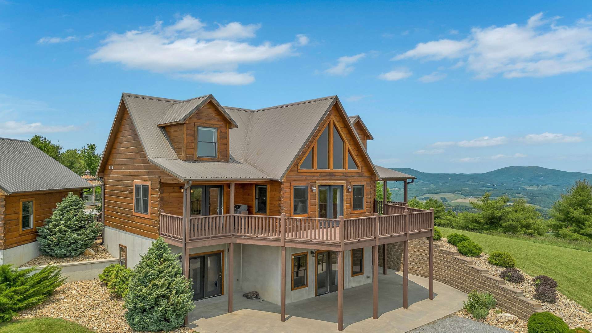Spacious patio is accessible from the lower level family room and two of the bedrooms. Enjoy a built-in fire pit where you can savor the warmth of a crackling fire on cool mountain evenings, creating a cozy and inviting outdoor retreat.