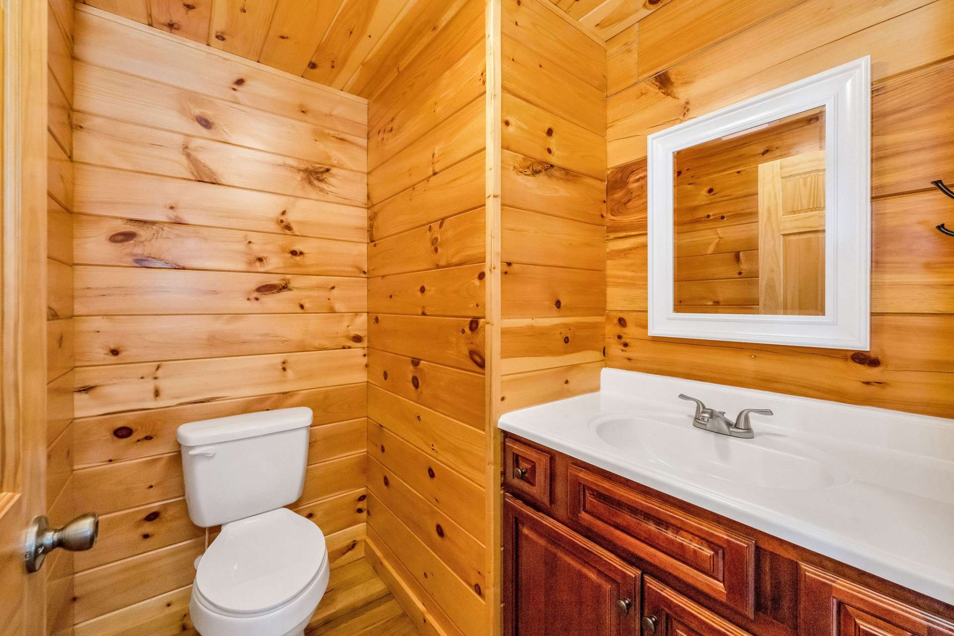 Conveniently located just off the foyer, the powder room features tasteful finishes and is perfect for guests.