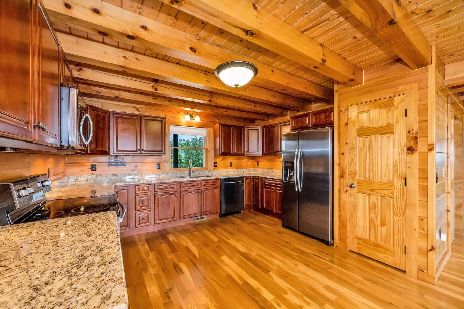 Granite countertops offer generous workspace and elevate the kitchen with their timeless, high-end appeal.