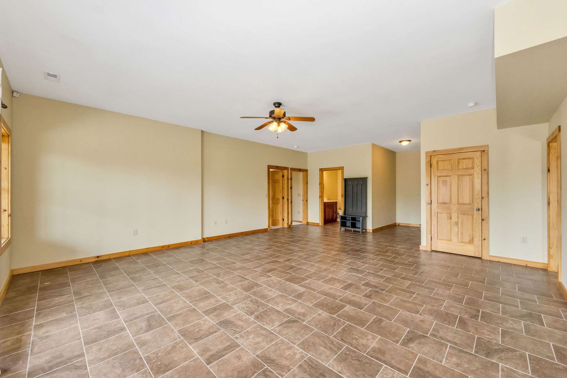 Three adjoining rooms off the family area offer flexible options, whether you need extra bedrooms, a home gym, or hobby spaces.