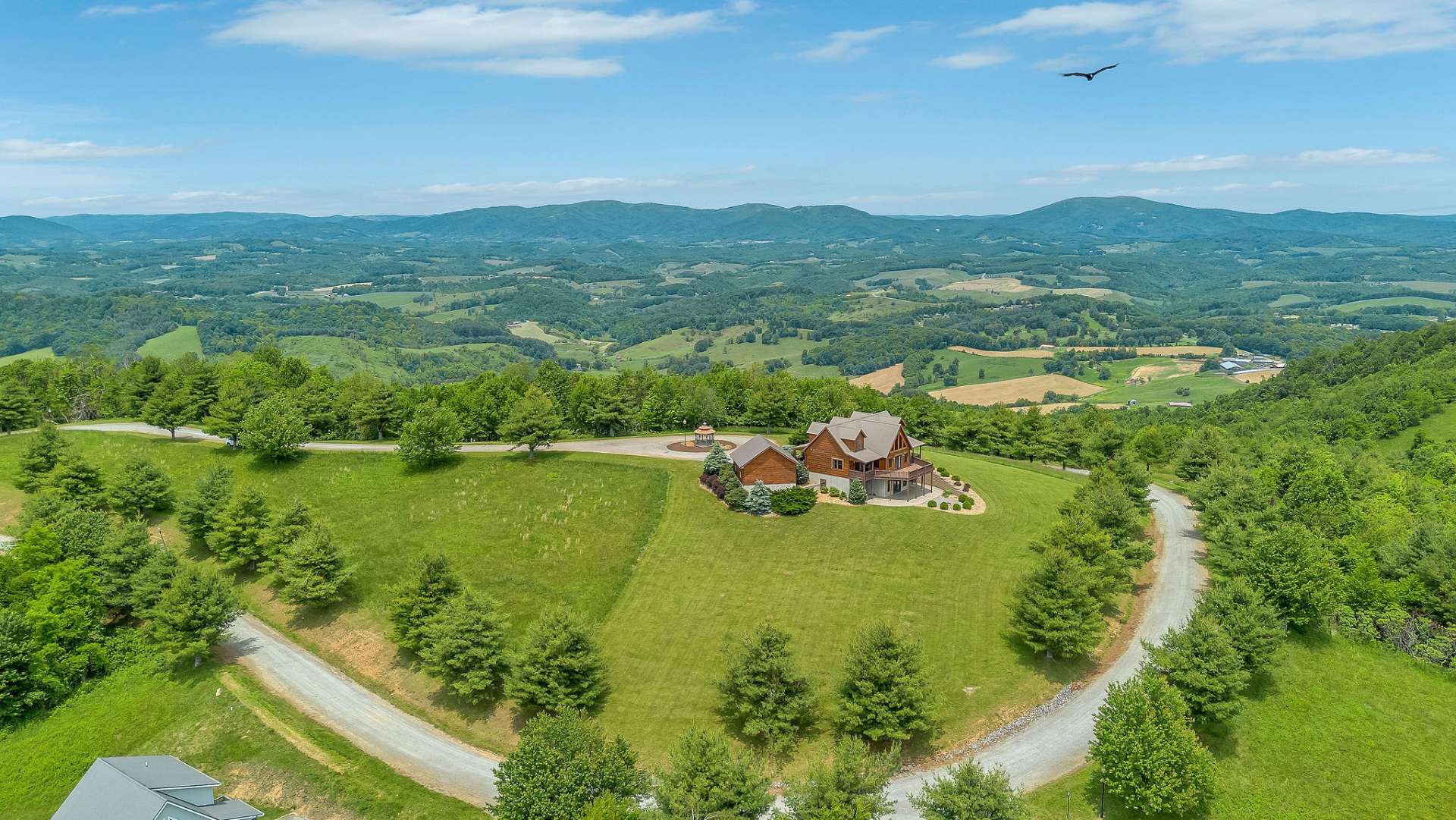 Situated at the highest point in Twin Oaks Mountain Estates—at an elevation of 3,533 feet—this property offers breathtaking long-range views from nearly every angle that stretch endlessly across the Blue Ridge Mountains.