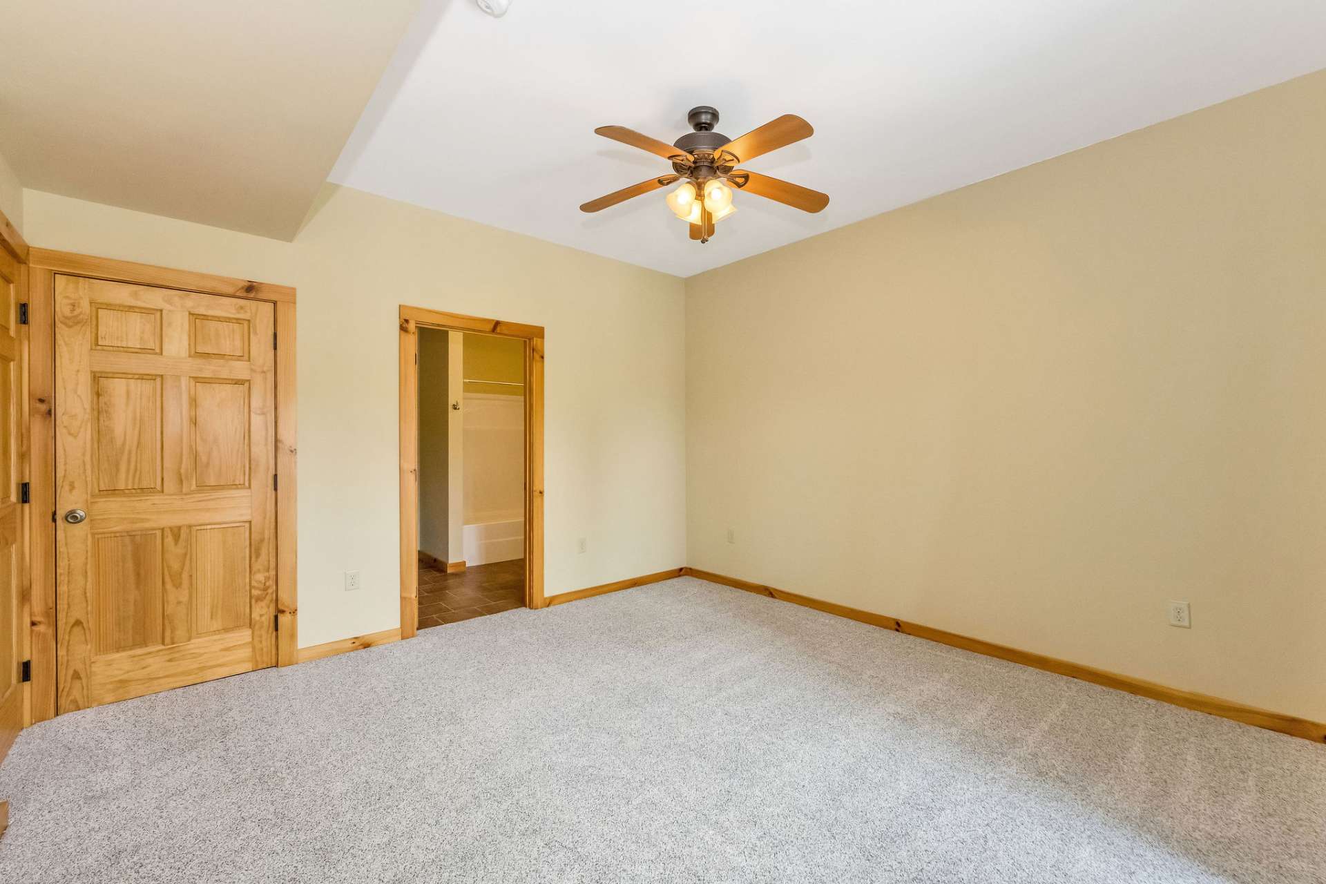This bedroom includes a private, full en suite bath for added convenience and privacy.
