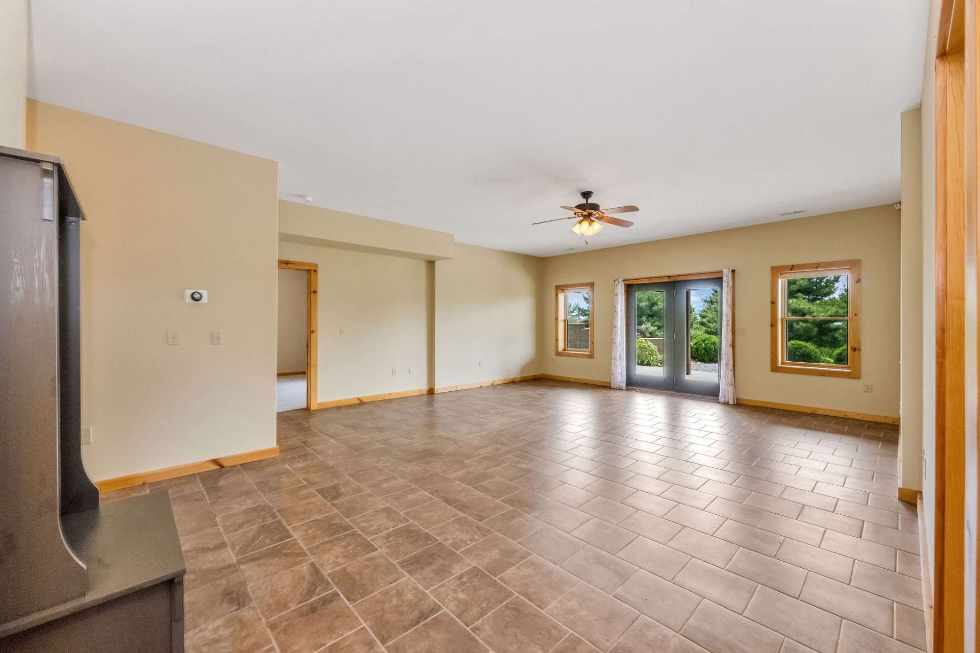 Step outside easily to the inviting patio and fire pit area—perfect for cozy evenings or outdoor gatherings.