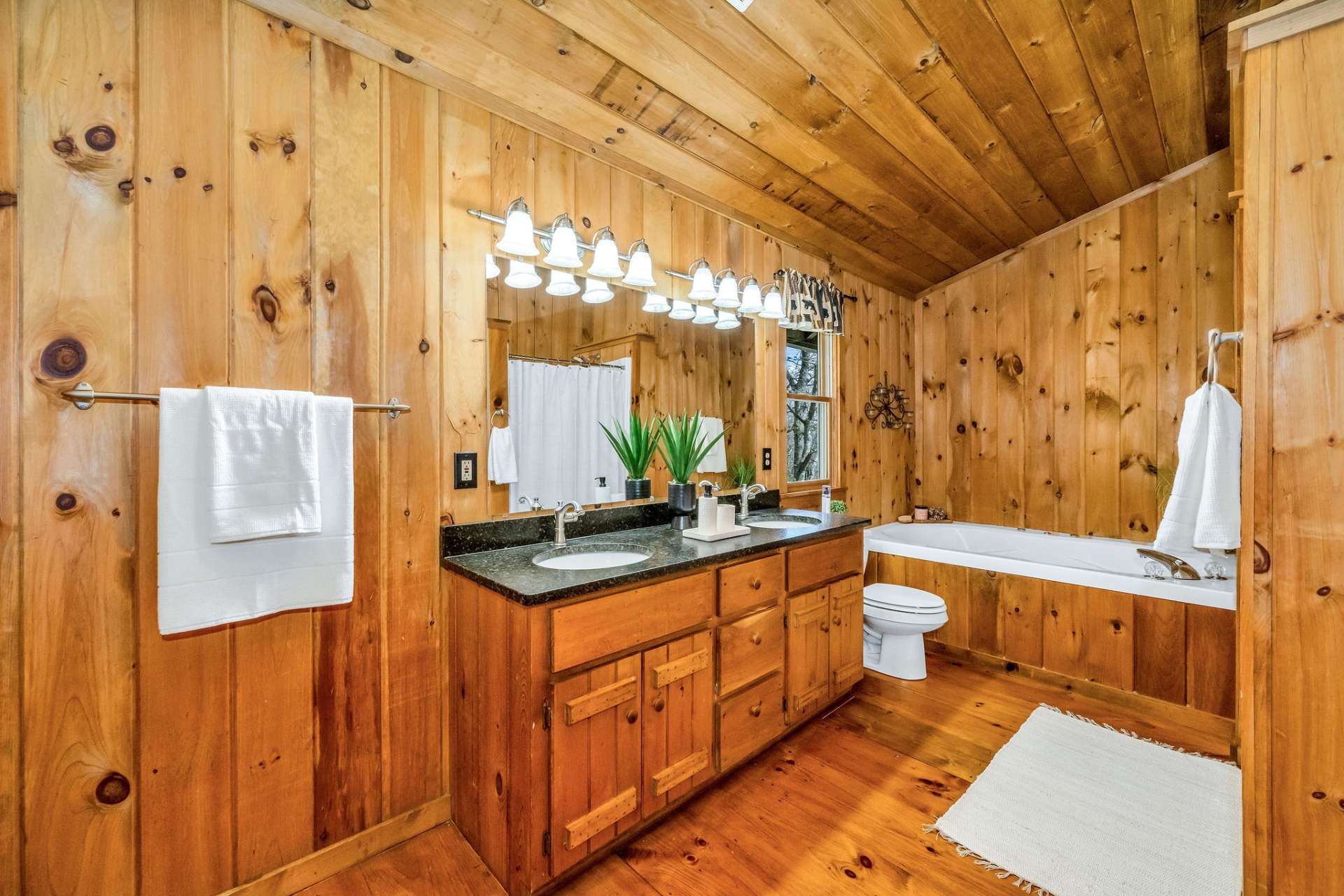 The luxurious primary bath evokes a spa-like atmosphere.